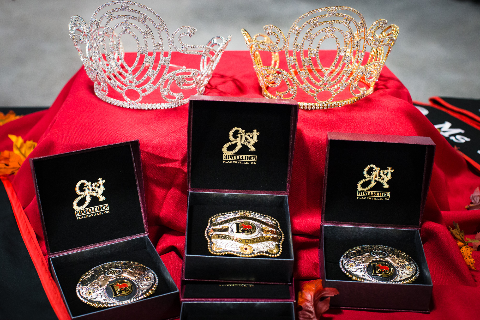 Crowns, sashes, and custom belt buckles are some of the awards doled out to the winners of the International Gay Rodeo Association's Royalty Contest. The titles of Mr., Ms., Miss, and MsTer are awarded after contestants successfully complete the int