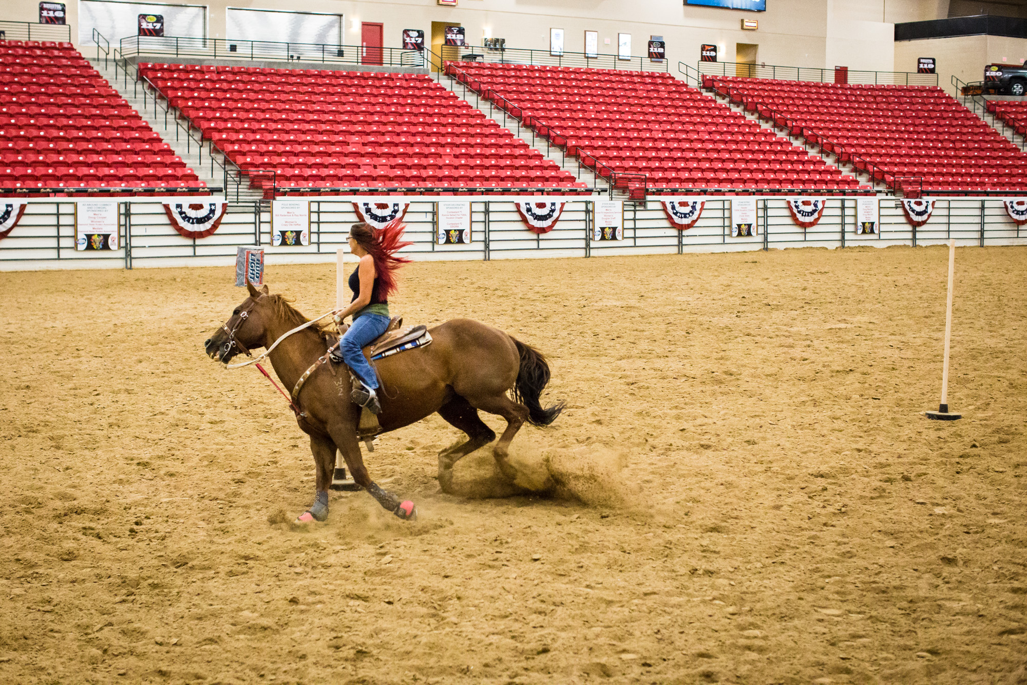  Britany Davis, of Boulder City, NV, takes her horse Kid on a practice run of pole bending at the World Gay Rodeo Finals in Las Vegas, NV. 