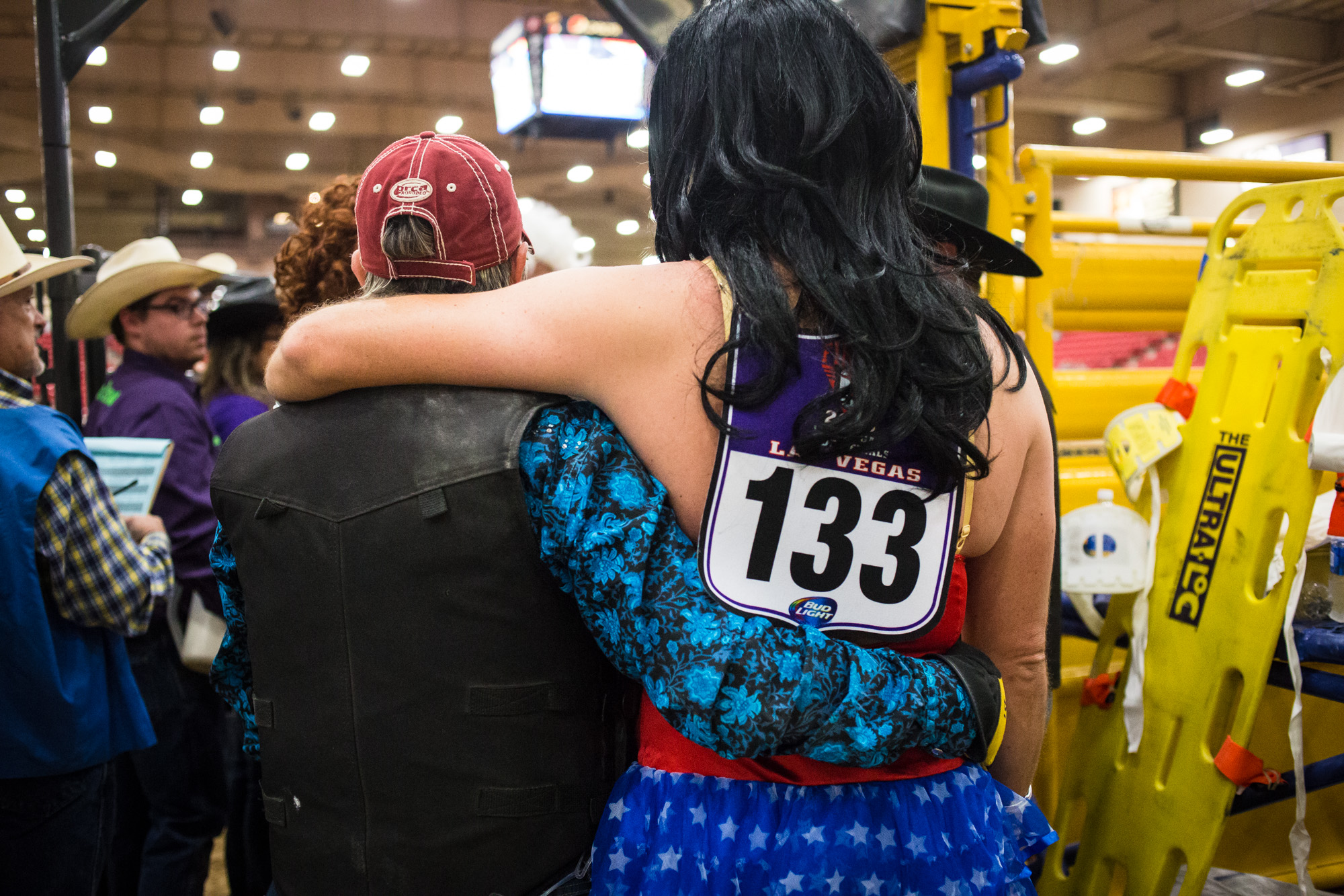  David Lawson, dressed as Wonder Woman, embraces another contestant during the Wild Drag Race at the World Gay Rodeo Finals in Las Vegas, NV. 