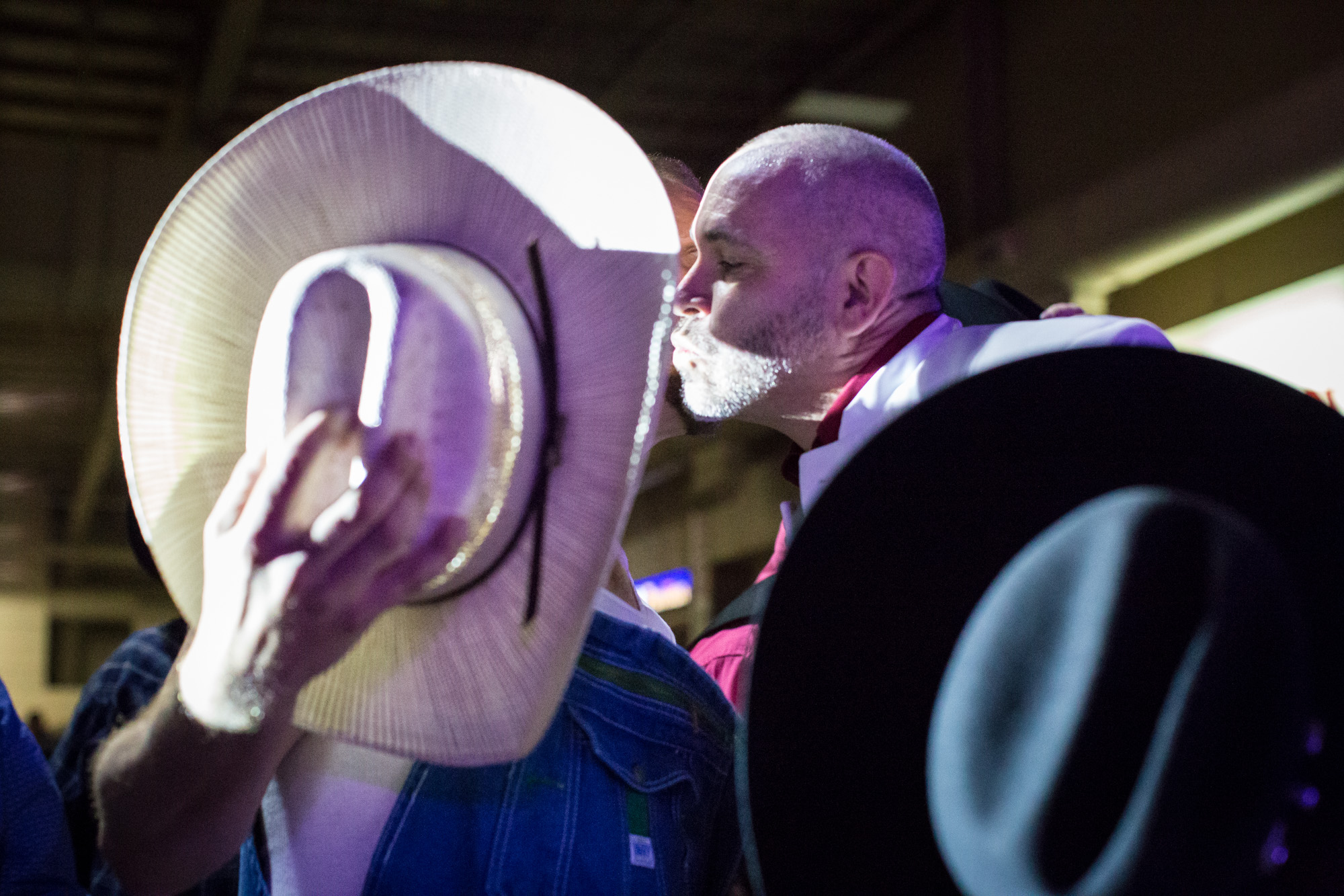 IGRA Vice President James Jenkins receives tips and greets audience members with a kiss during his performance at the Royalty Competition of the World Gay Rodeo Finals in Las Vegas, NV.