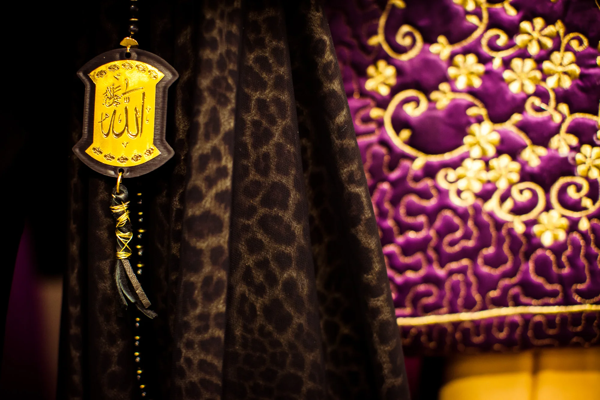 Fashion accessories inscribed with “Allah” in Arabic at a fashion show hosted by RAHMA in Washington, DC.