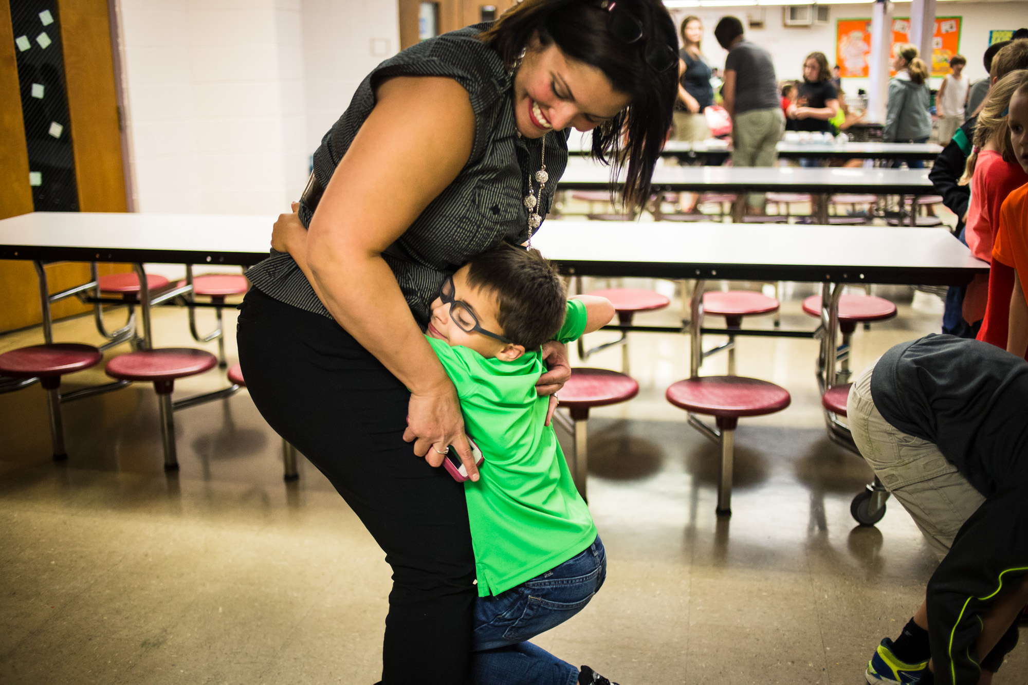  Treven greets his mother, Bettina, with a big hug after school. 