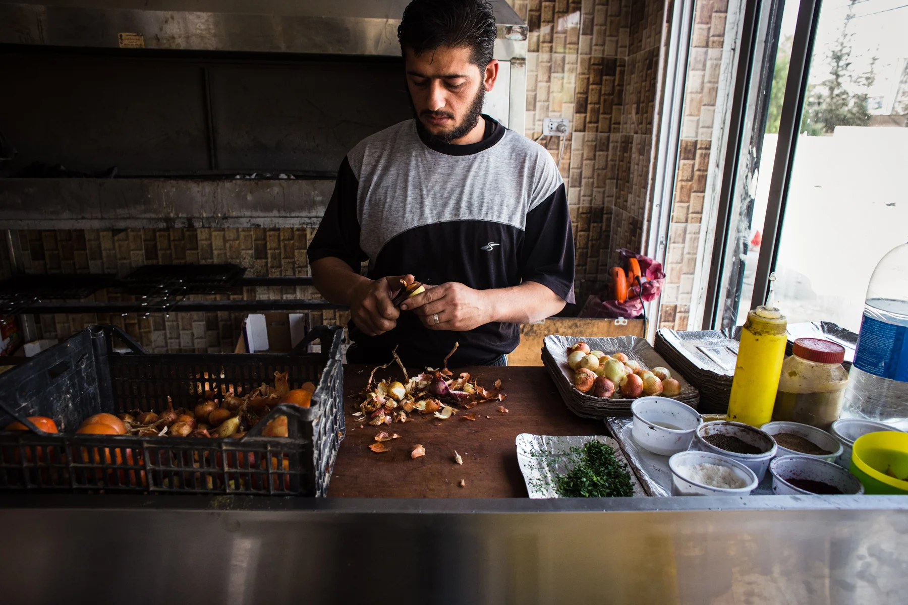 Abu Hamad (not pictured), a Jordanian citizen, owns a butcher shop in Mafraq city and employs four Syrian refugees. He paid for all of their work permits so that they could work legally in Jordan.