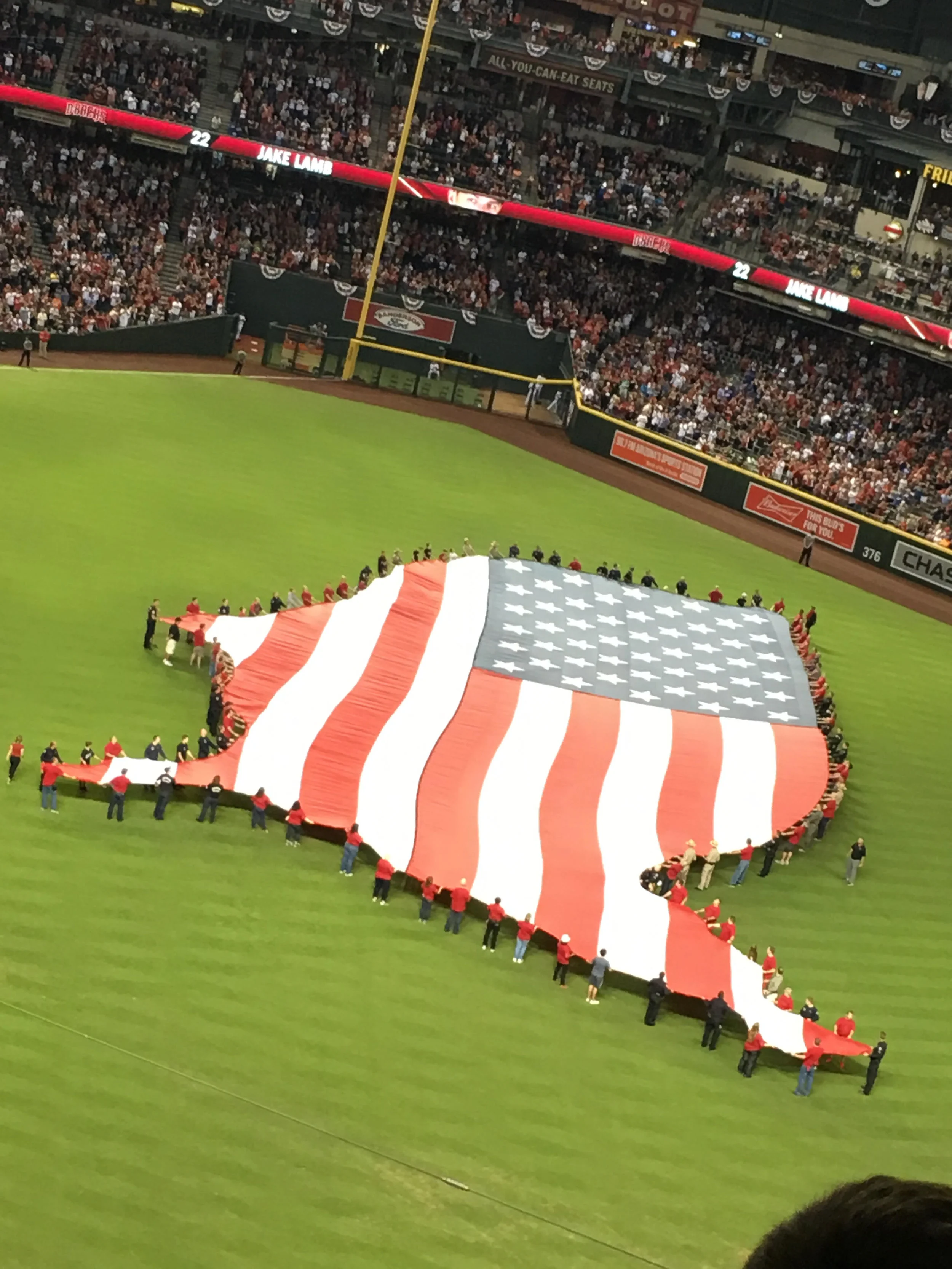 It was only fitting to have a beautiful American flag in the shape of our country for the national anthem just before the greatest Olympic athlete threw out the first pitch!