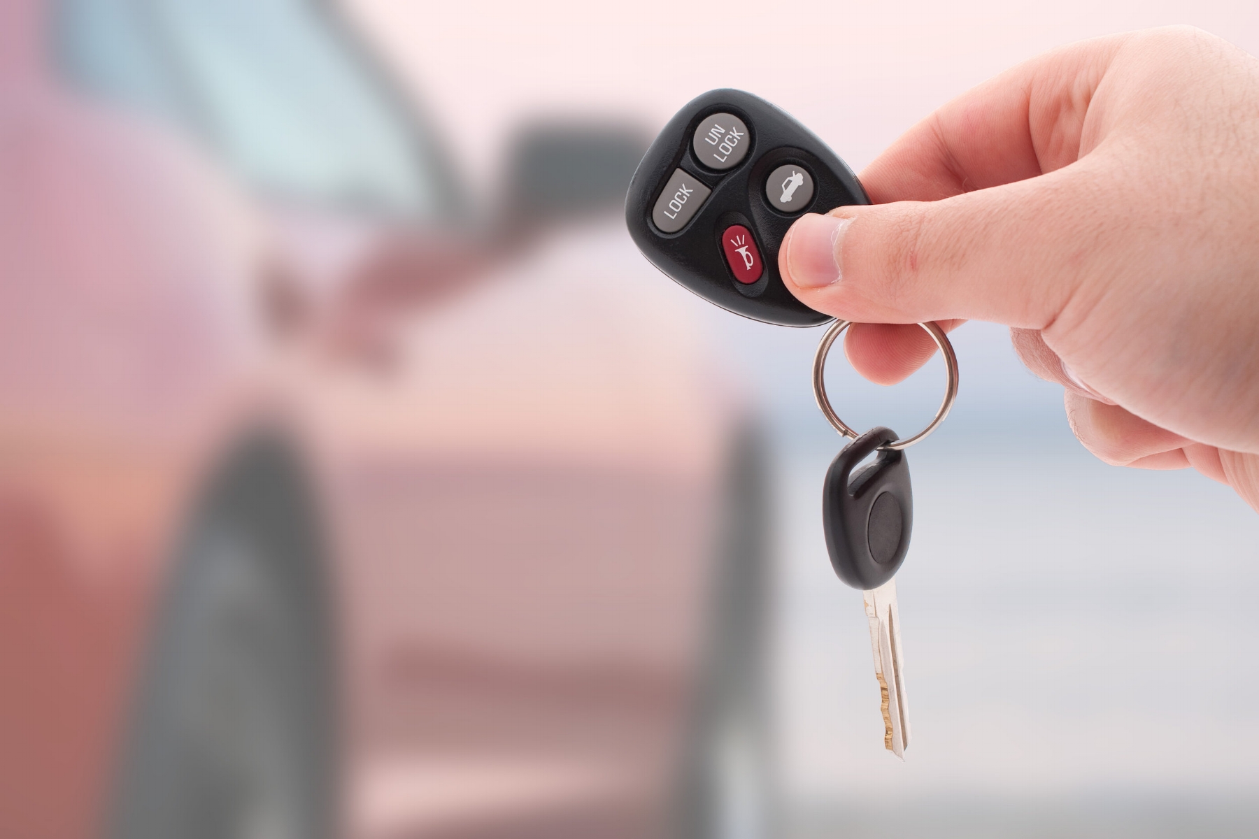 a-hand-holding-car-keys-and-a-remote-control-for-keyless-entry-isolated-over-white_HYswXvCSj.jpg