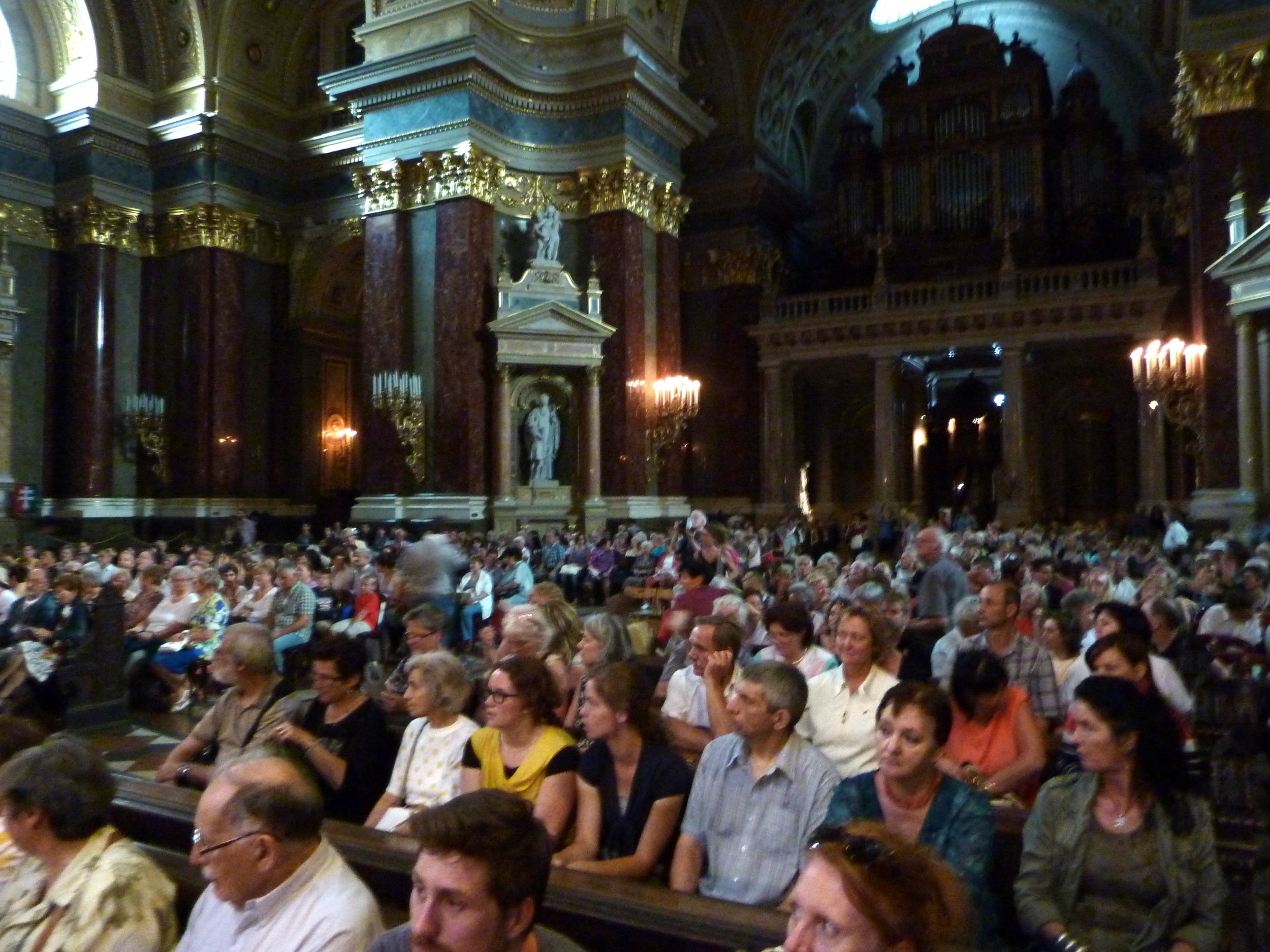 Audience is arriving for Metropolitan Flute Orchestra concert at St. Stephen's Basilica in Budapest, Hungary