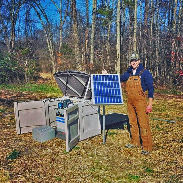 Watershed Scientist Tim Rosen near a wood chip bioreactor installed on a local farm in Maryland.