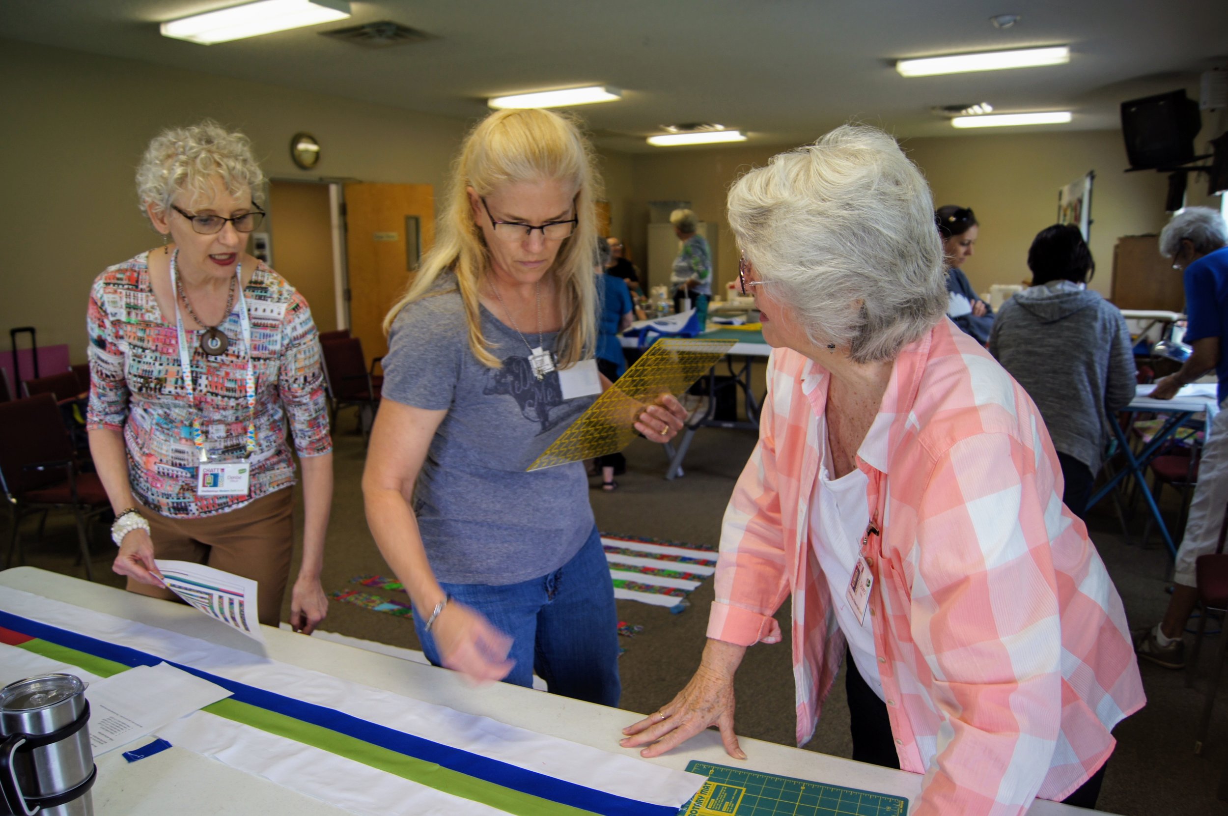 Denise, Sara and Delores prepare the strips of solids