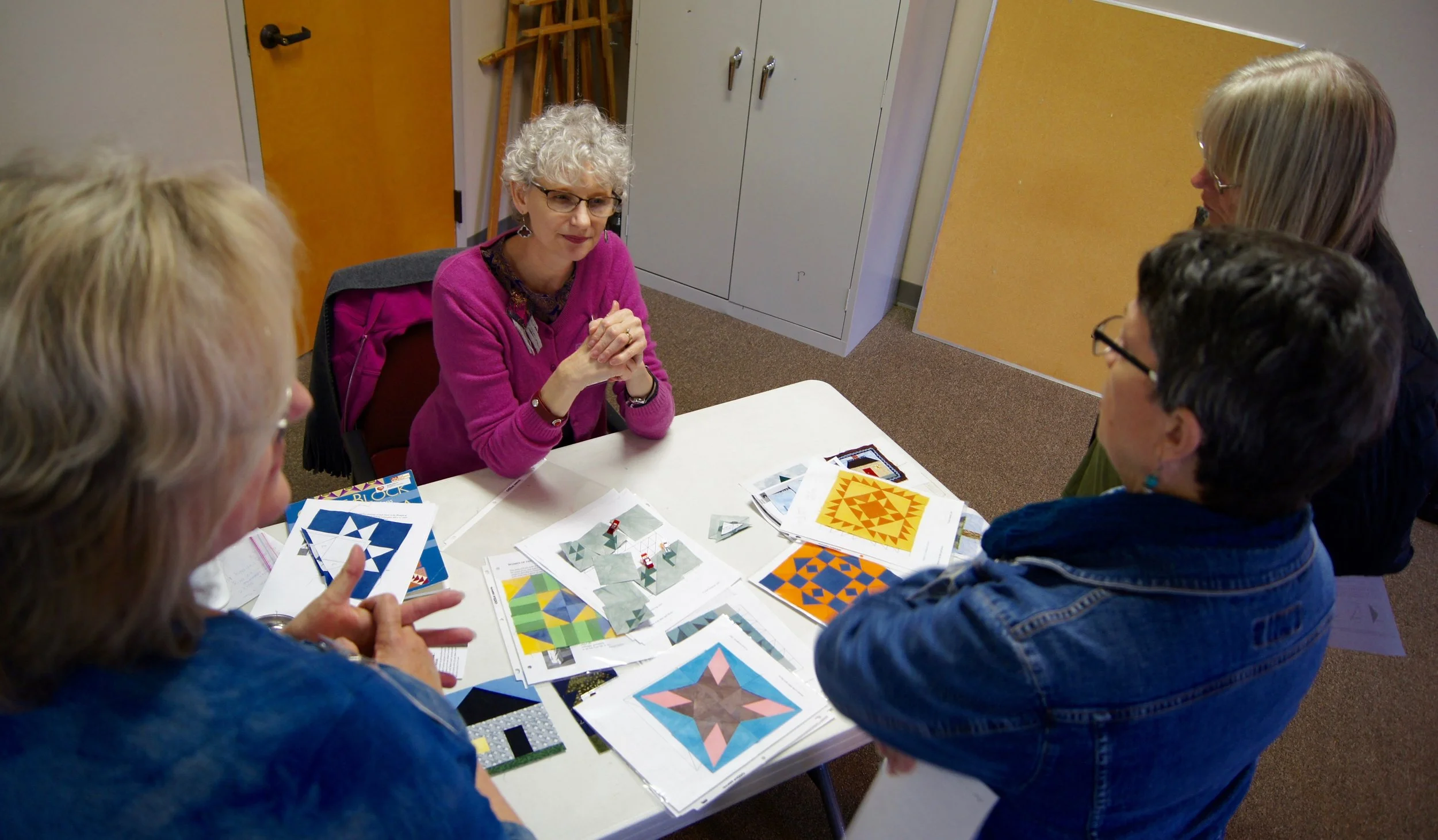 Denise Ohlman showed members several examples of complex paper piecing patterns.