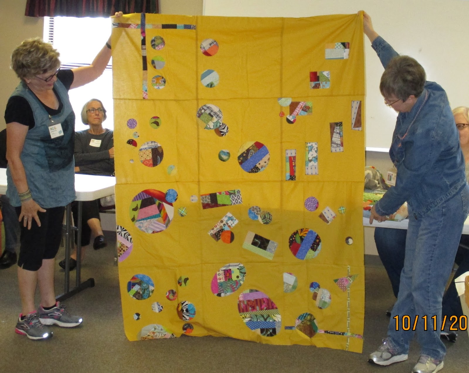 Ann (left) and Patricia (right) show off Team Sandi's quilt top