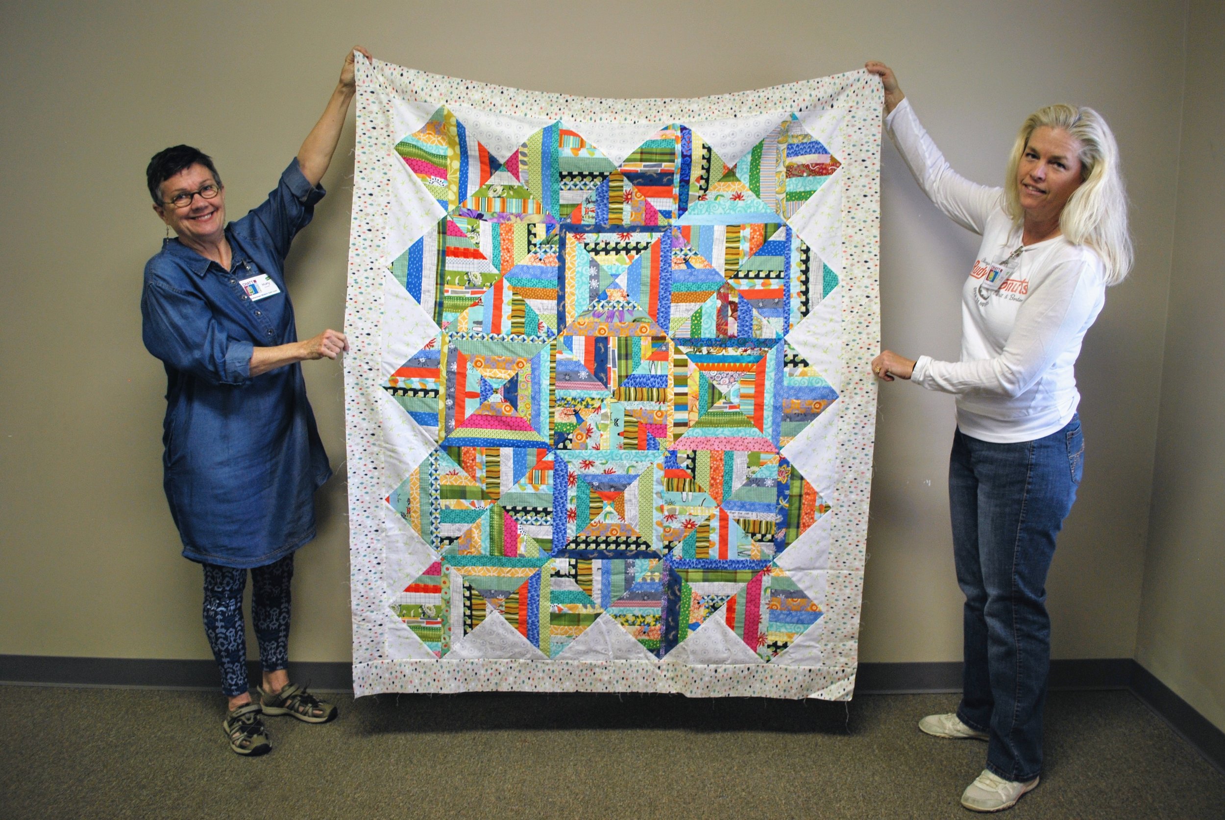 Mary Keasler (left) made this top to donate to Sara Bradshaw's Operation Underground Railroad effort.