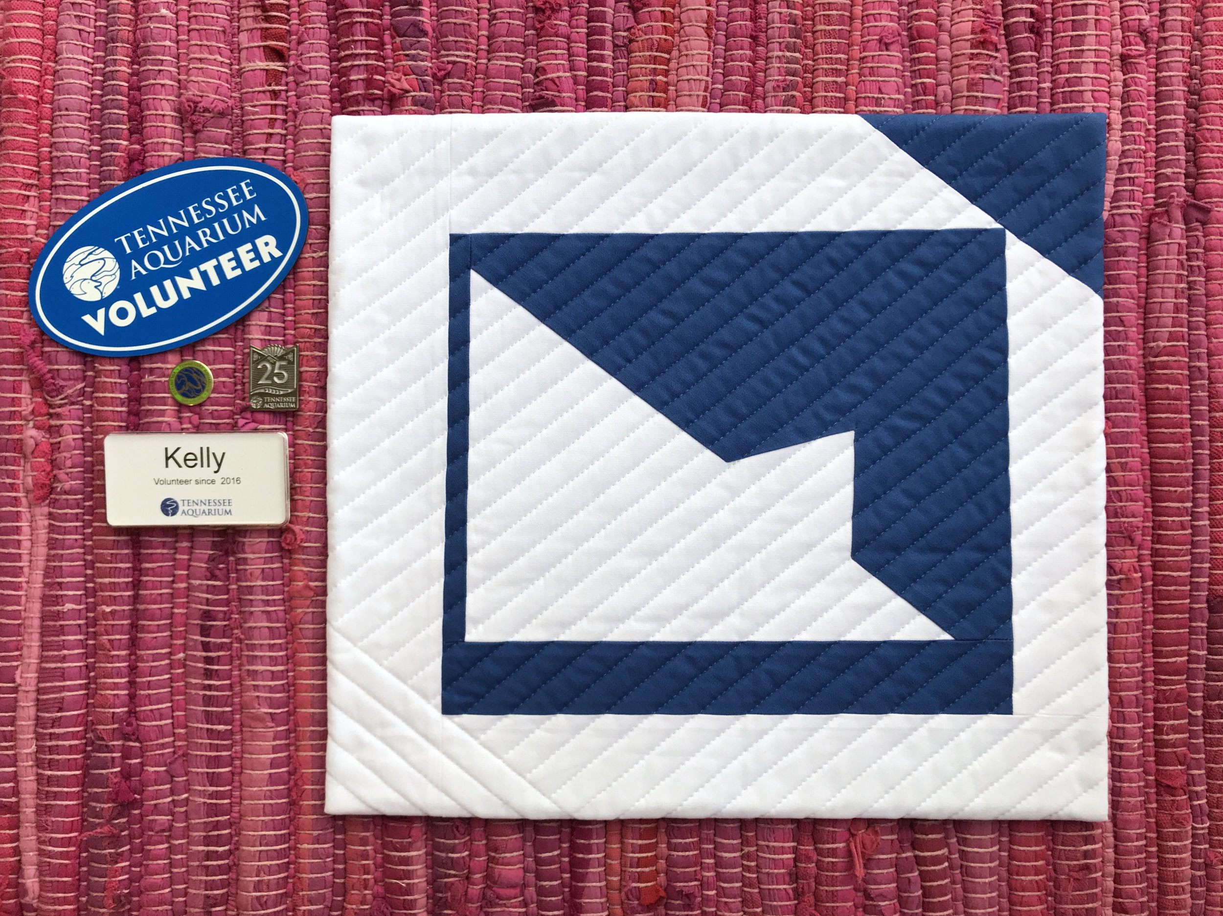 Kelly Spell's mini quilt entitled "Peaks of Change" was inspired by the roofline of Tennessee Aquarium.