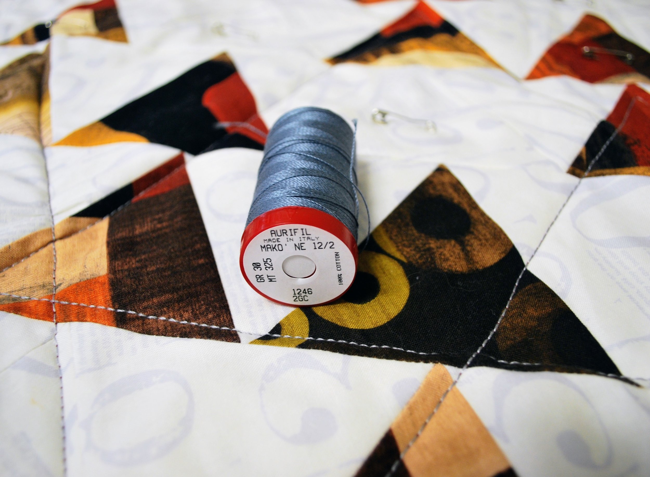 To mimic the look of hand quilting with your sewing machine, try a thicker thread such as Aurifil's 12wt cotton.