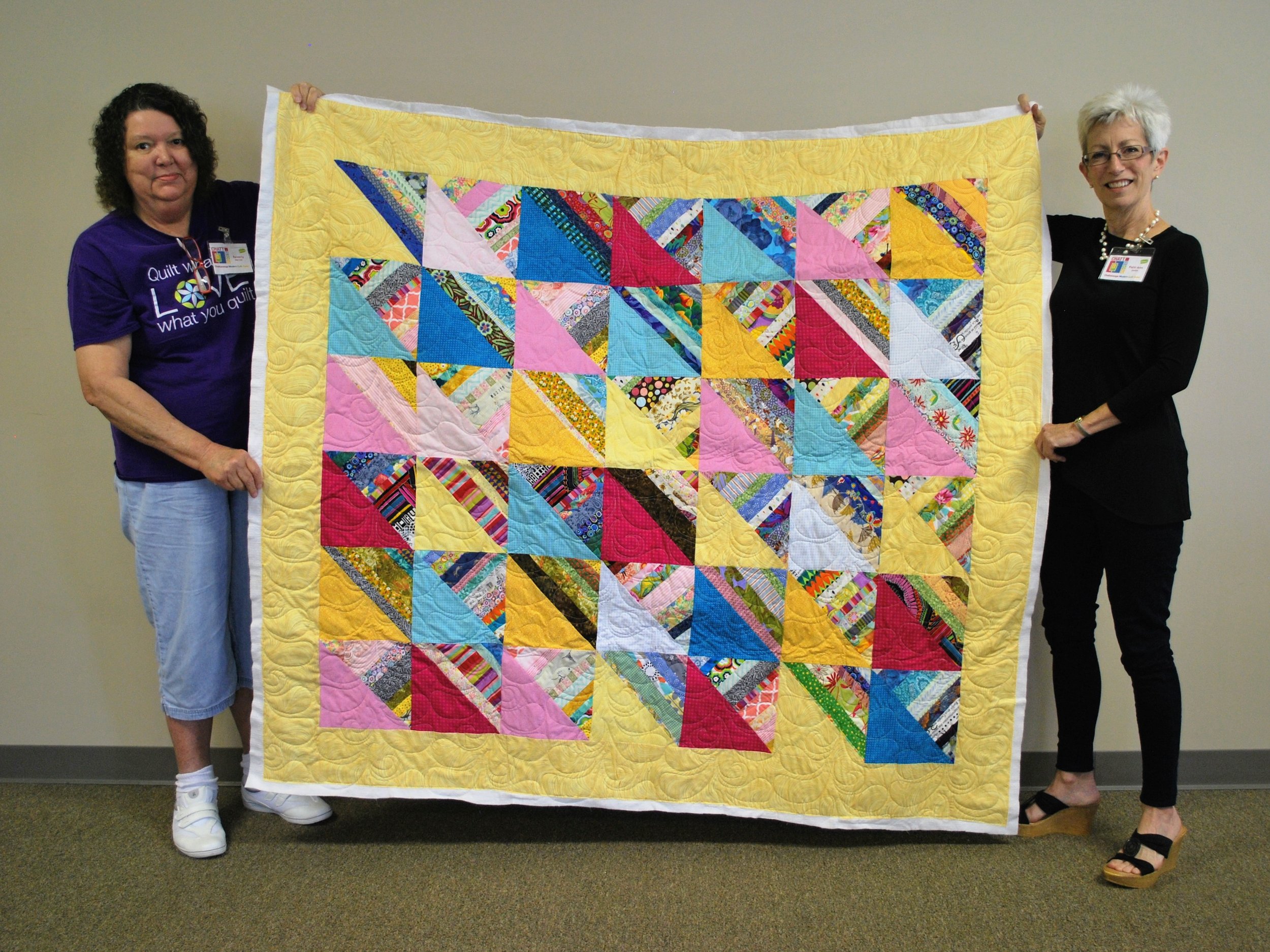 Beverly Herron (left) quilted this top pieced by Patti Ann Smith (right)