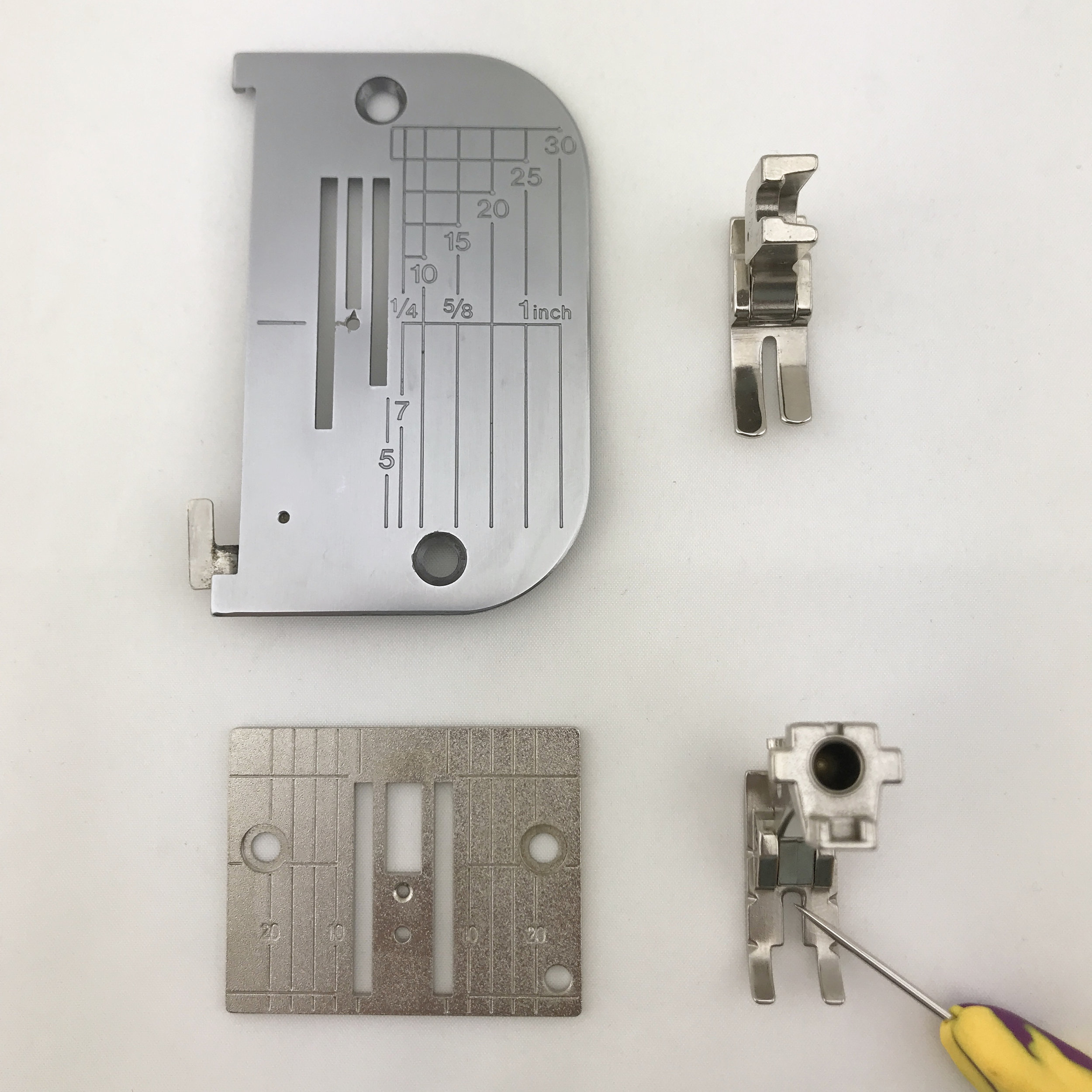 These are straight-stitch, single-hole presser feet and needle plates