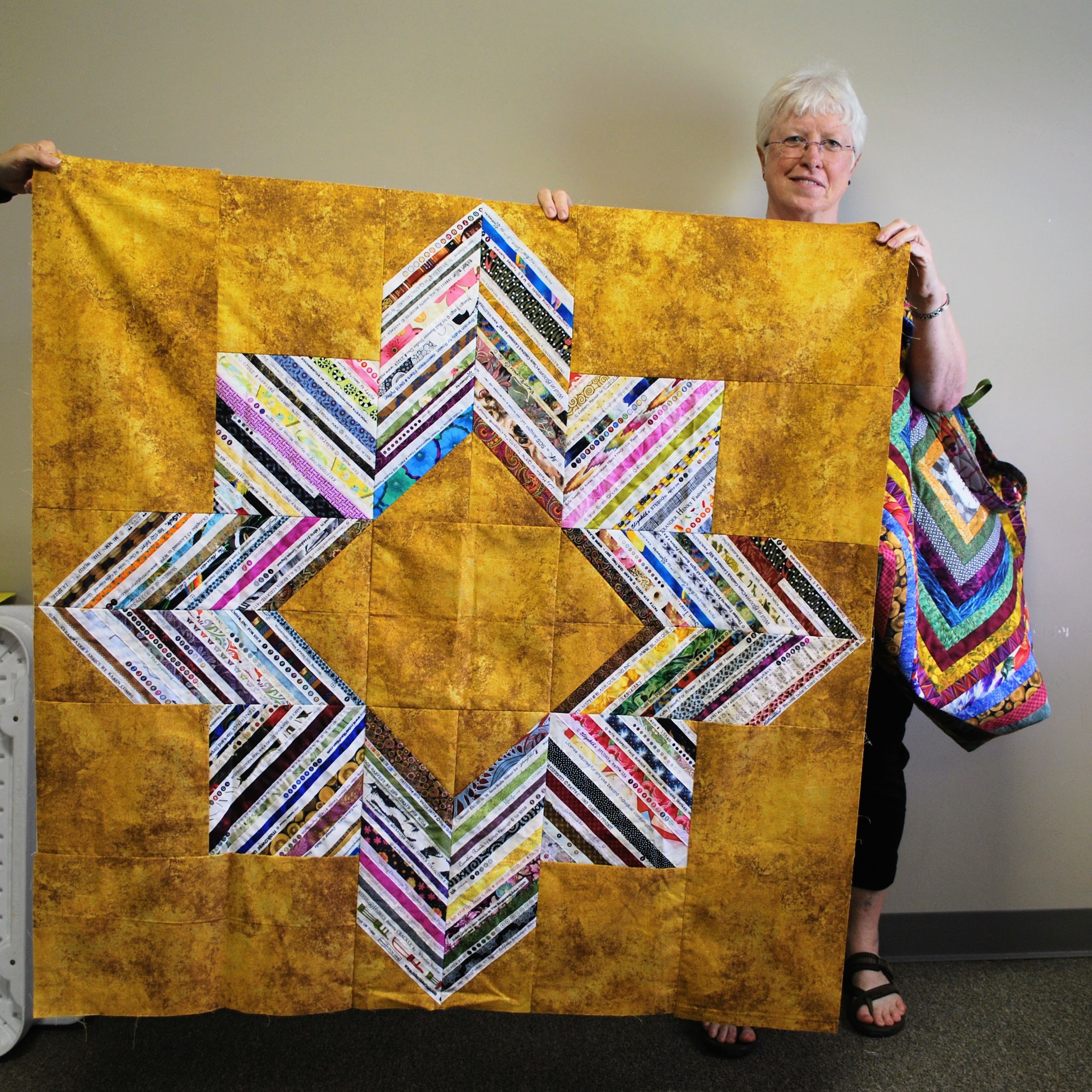 Selvage strip quilt top by Martha Steele