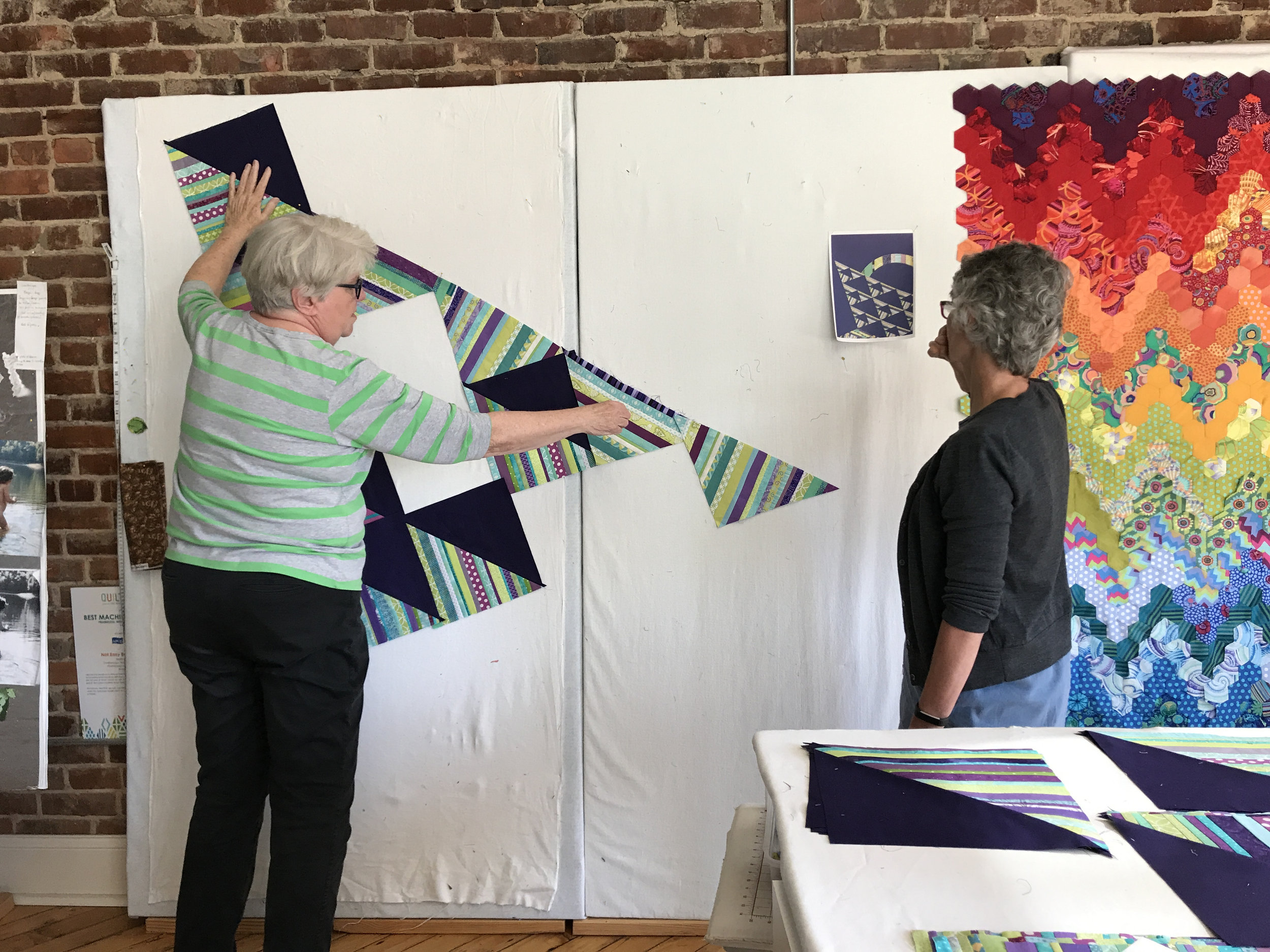 Jean and Audrey arrange blocks on an angle.