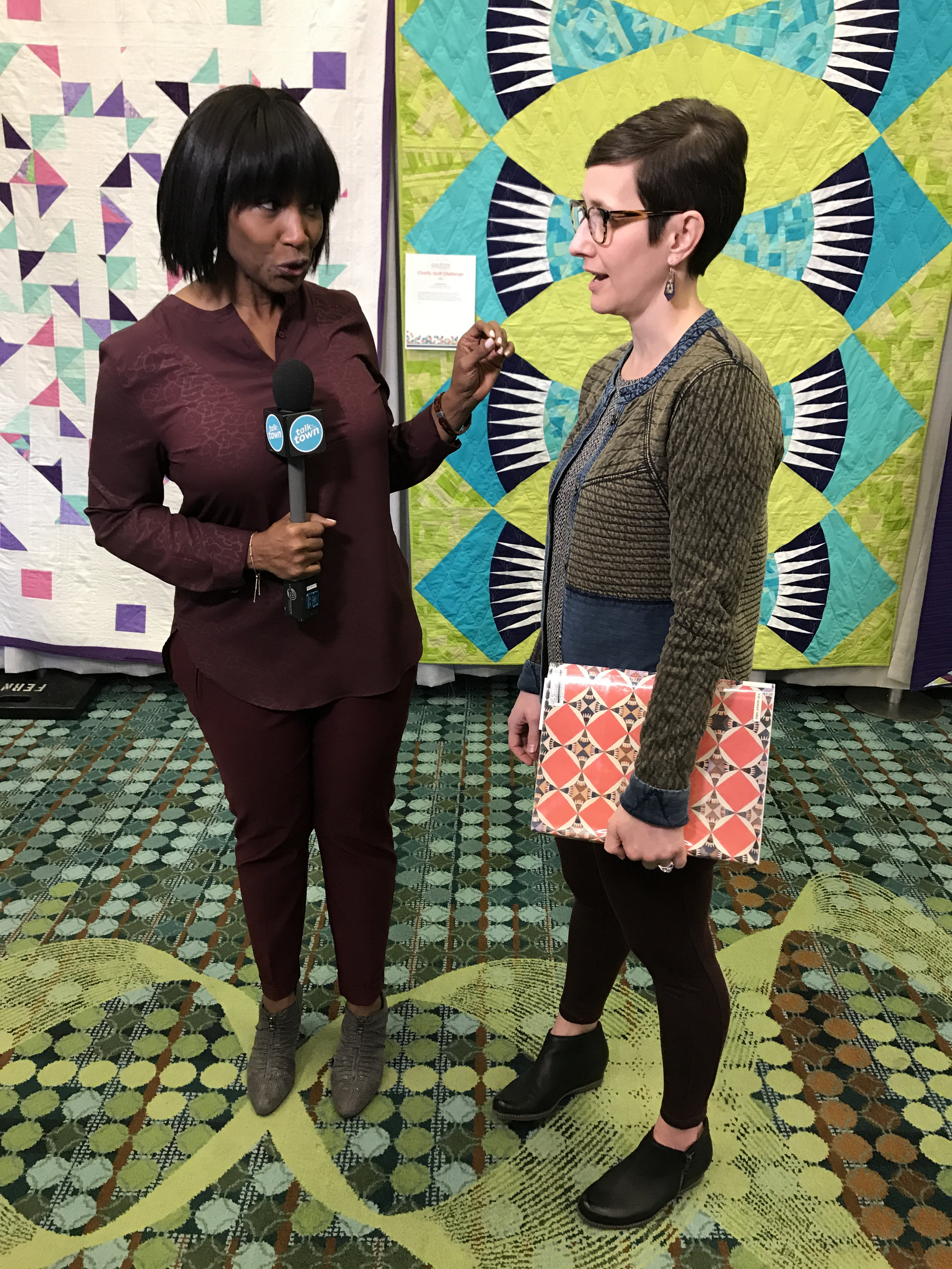 Kelly was interviewed by a local news station about our modern basket quilt