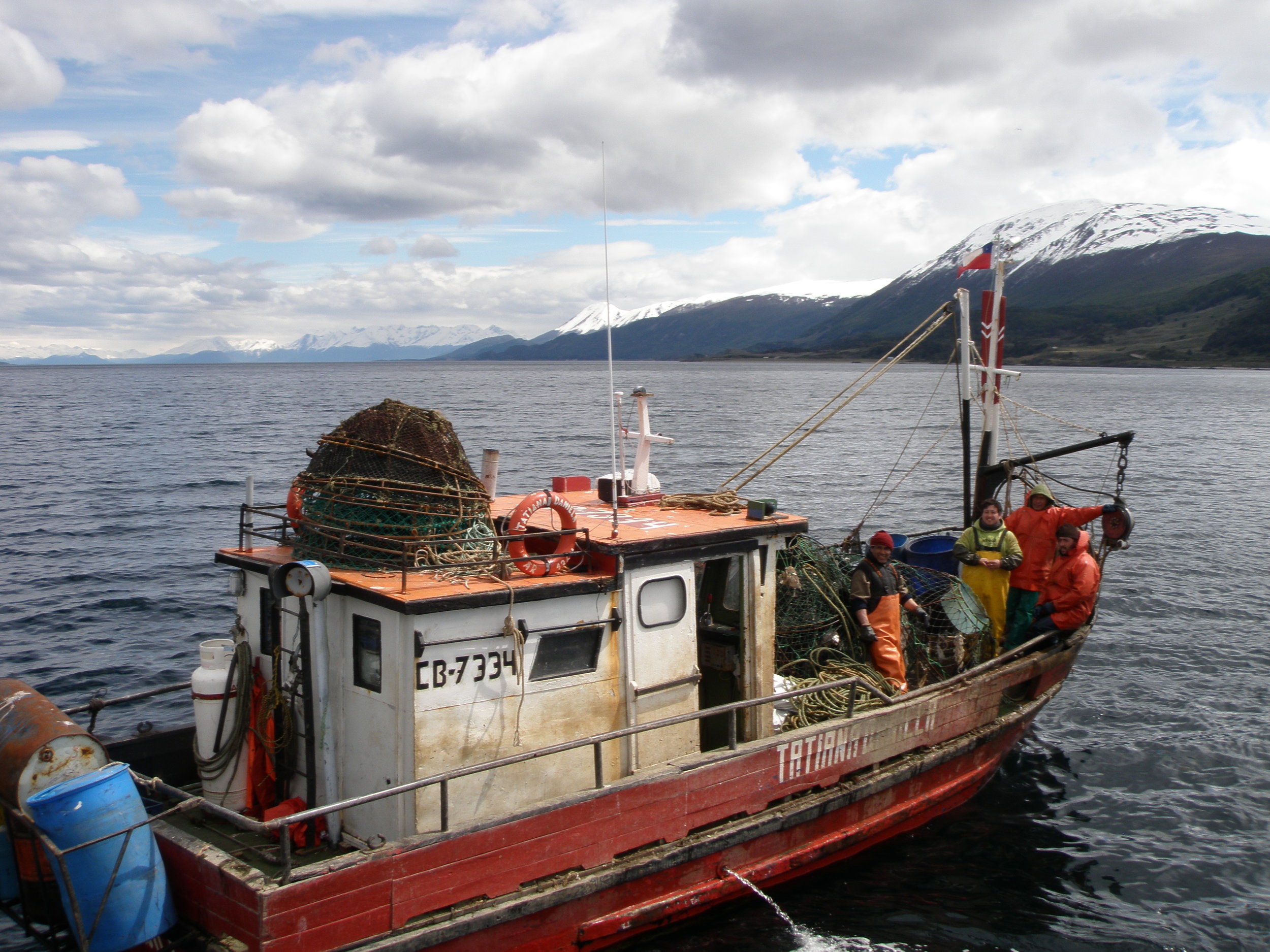 Fishing boat in Beagle Channel, a strait in the Tierra del Fuego archipelago. Across the channel you can see Chile.