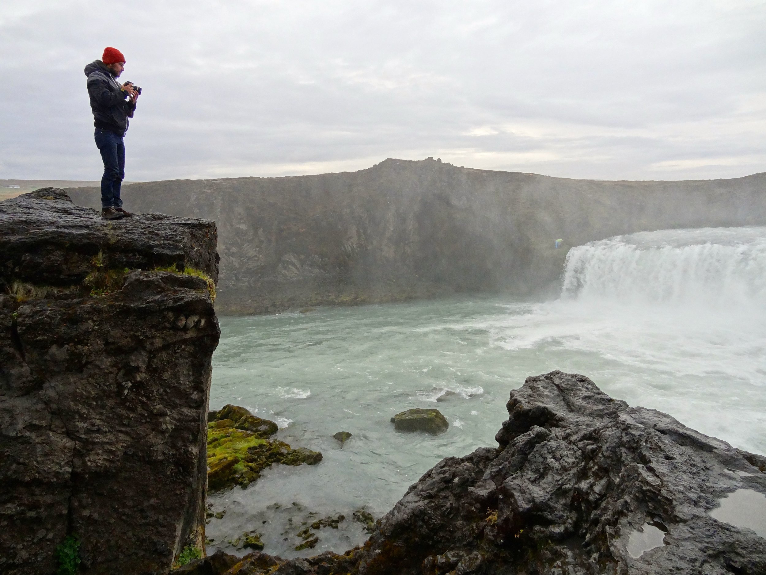 Lone photographer at Godafoss waterfall, Iceland.