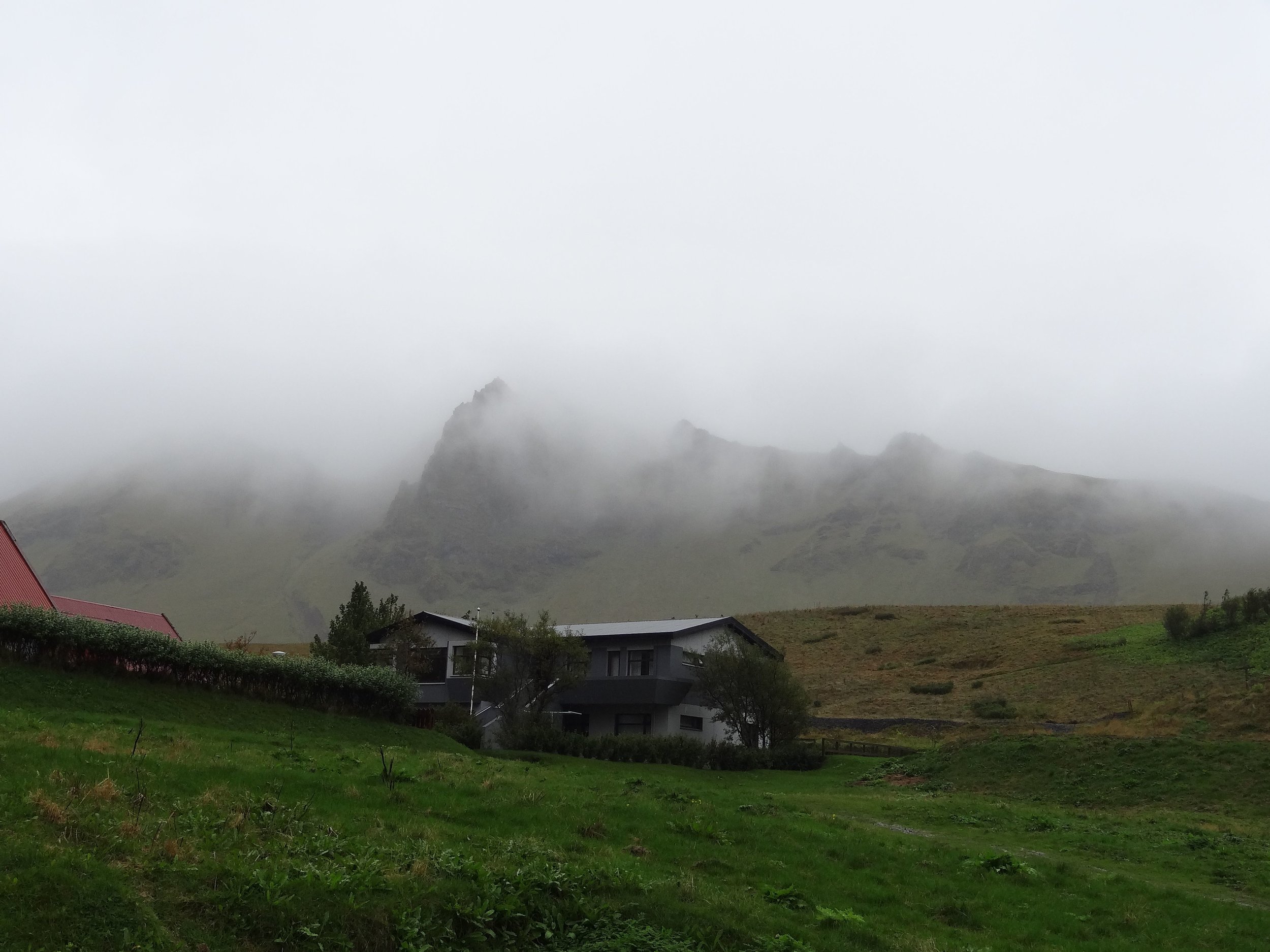 Fog along coastline, eastern Iceland.