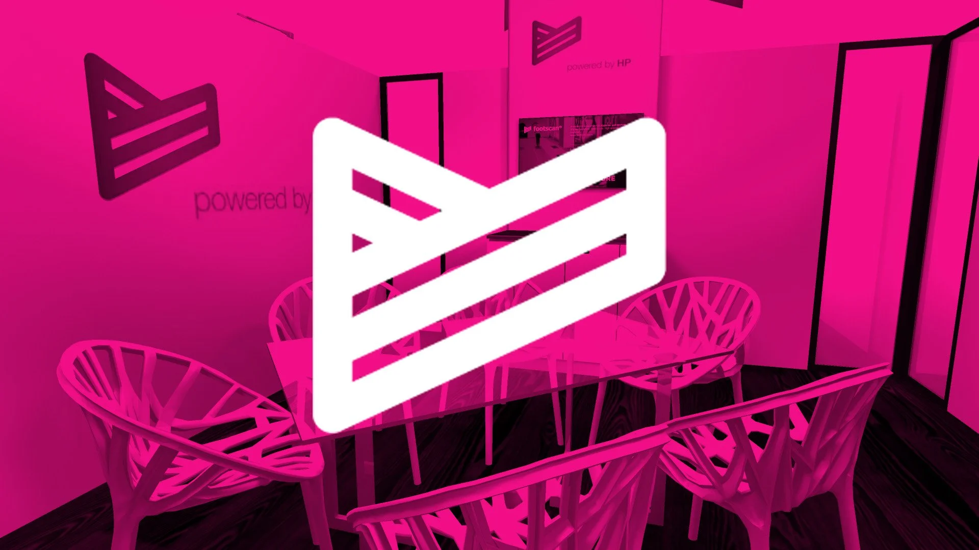 Interior of a trade show exhibit meeting room with a long table and 6 chairs with a pink translucent title block overlay featuring the RS Scan logo in white.