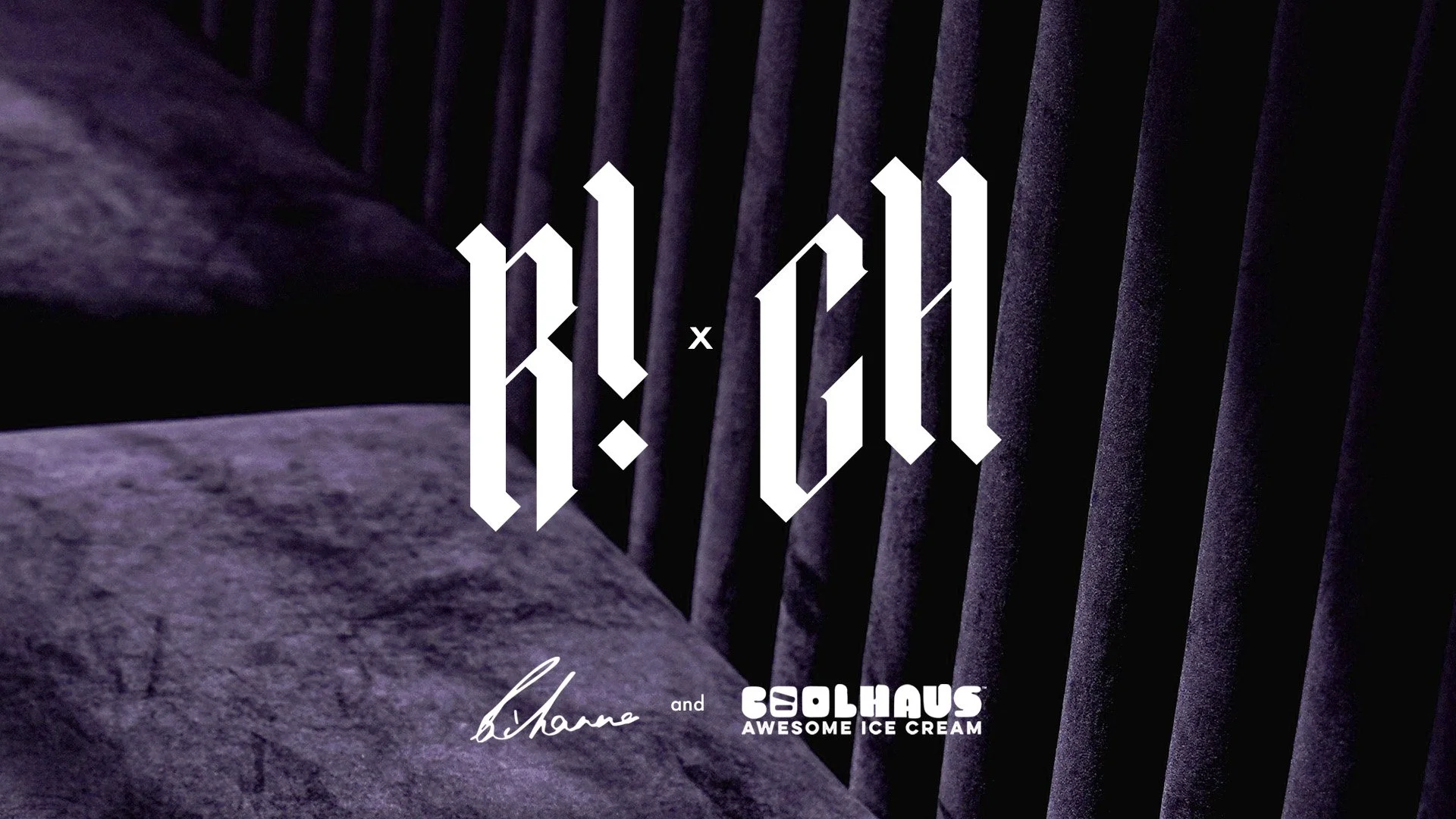 Dark purple velvet channeled sofa with the logo for the Rihanna and Coolhaus ice cream collab.