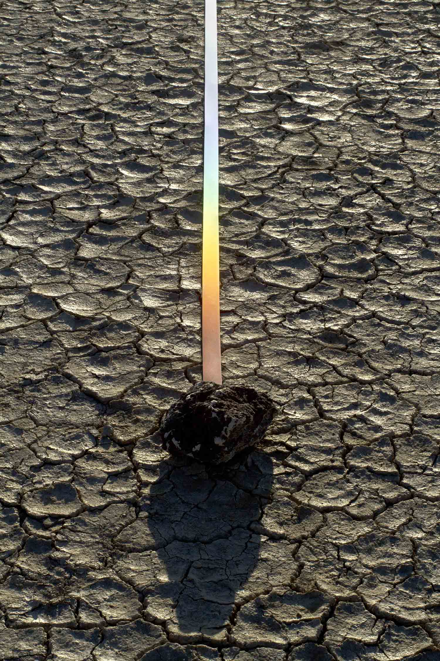    marking time in light  ,&nbsp;2014 (detail) reflective fabric tape, found stones, natural light 8.5 x 1.5 x 1494 in.  Alvord Desert, Eastern Oregon 