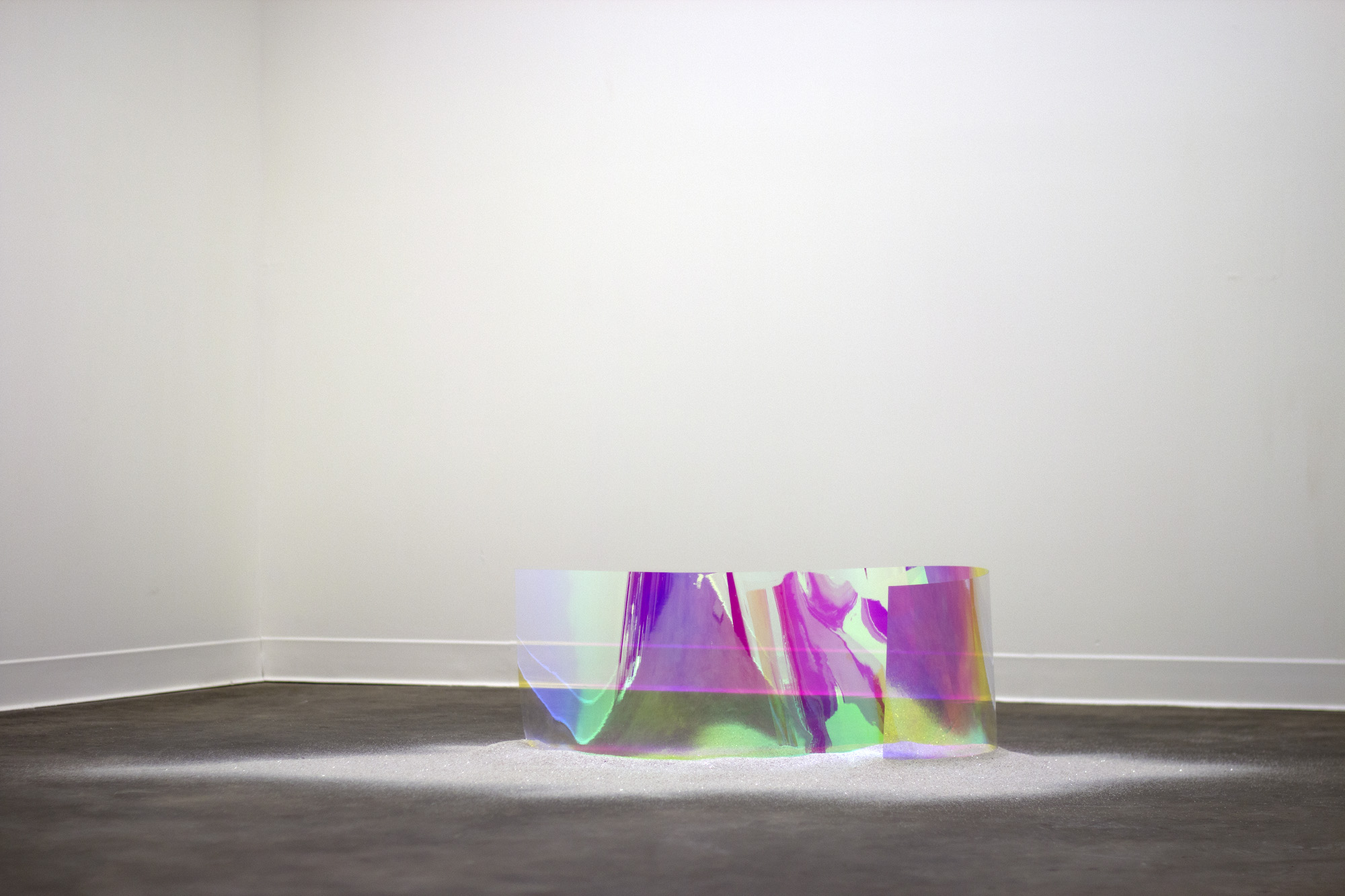    fissure  , 2015 dichroic film, quartz dust 12 x 58 x 30 in. as installed 