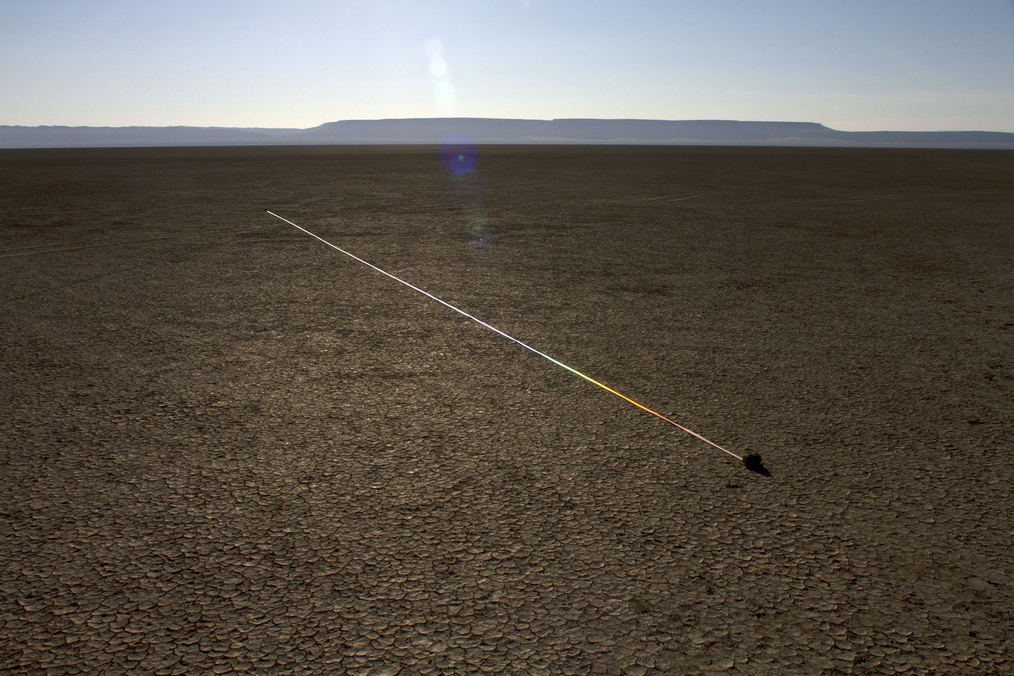    marking time in light  ,&nbsp;2014 reflective fabric tape, found stones, natural light 8.5 x 1.5 x 1494 in. image credit |&nbsp; Ian Clark   Alvord Desert, Eastern Oregon 