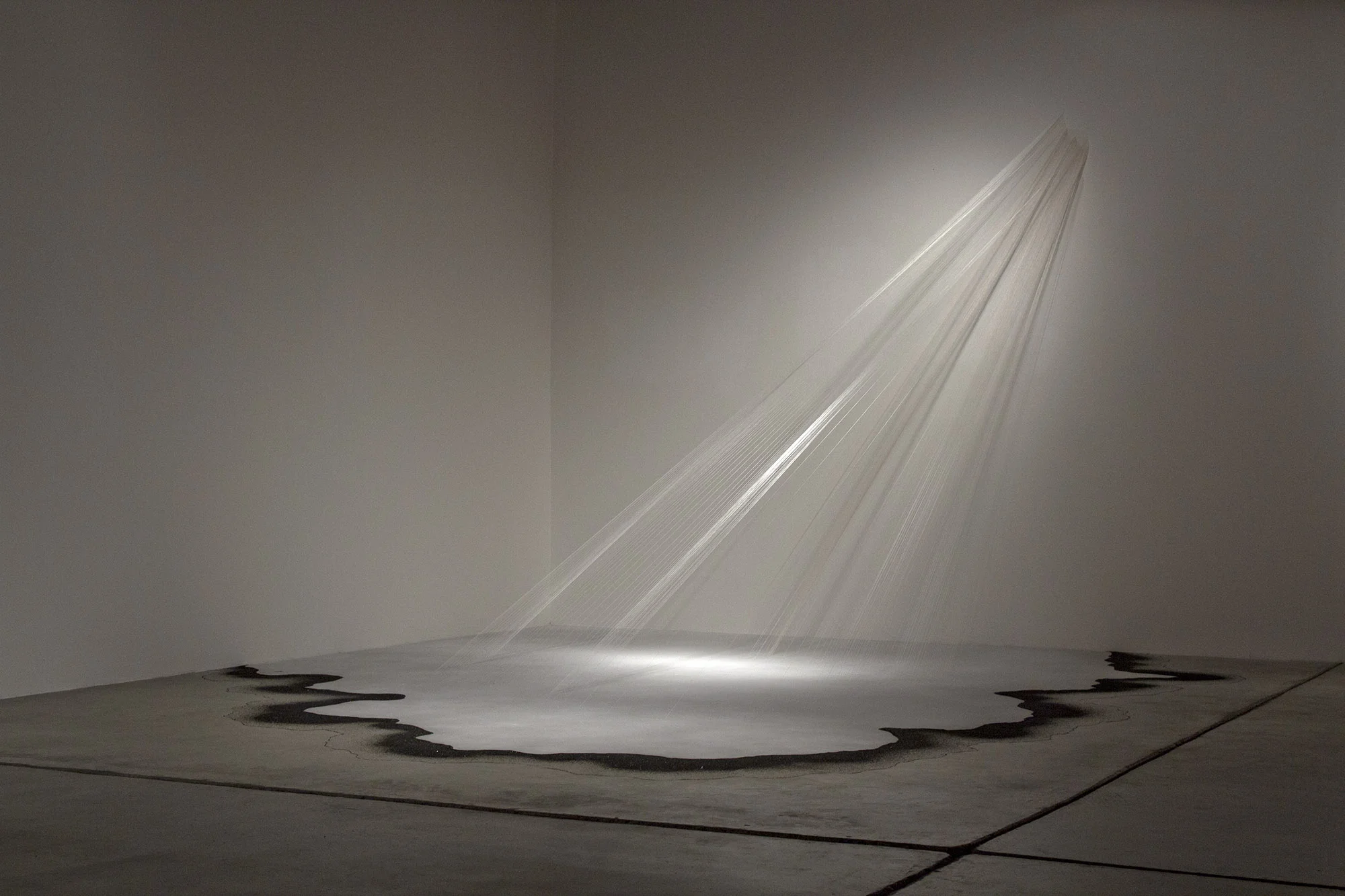 conditional presences , 2013 silk string, glass microspheres, coal slag, light 9 x 13.5 x 16 ft. Disjecta , Portland OR