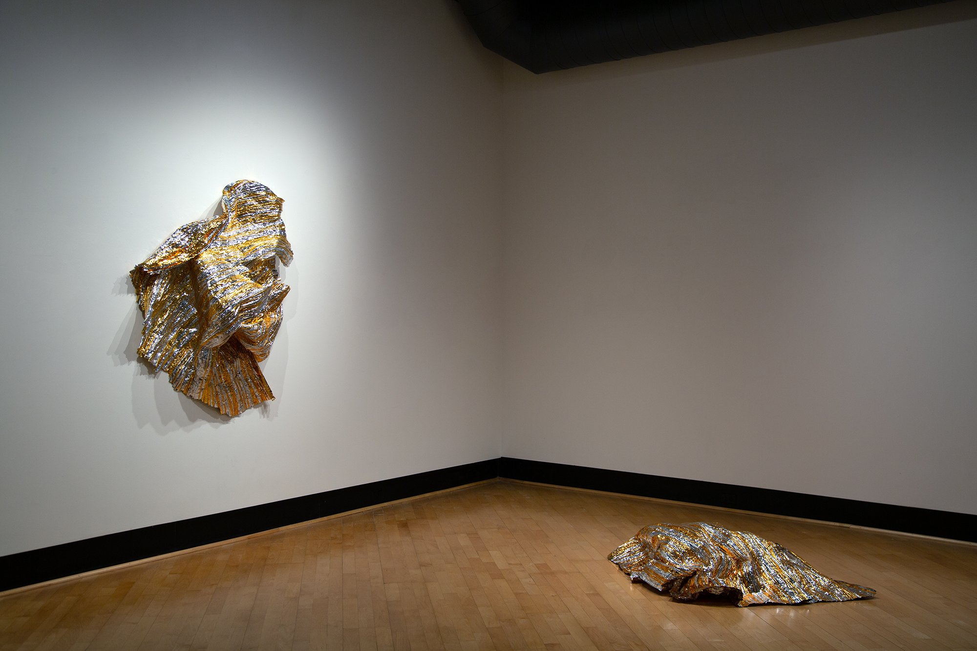    cloud shatter  , 2023 cut and stitched mylar space blankets 7 x 11 x 7 ft. as installed  Kristen Wigley-Fleming Gallery, Luther College, Decorah IA 