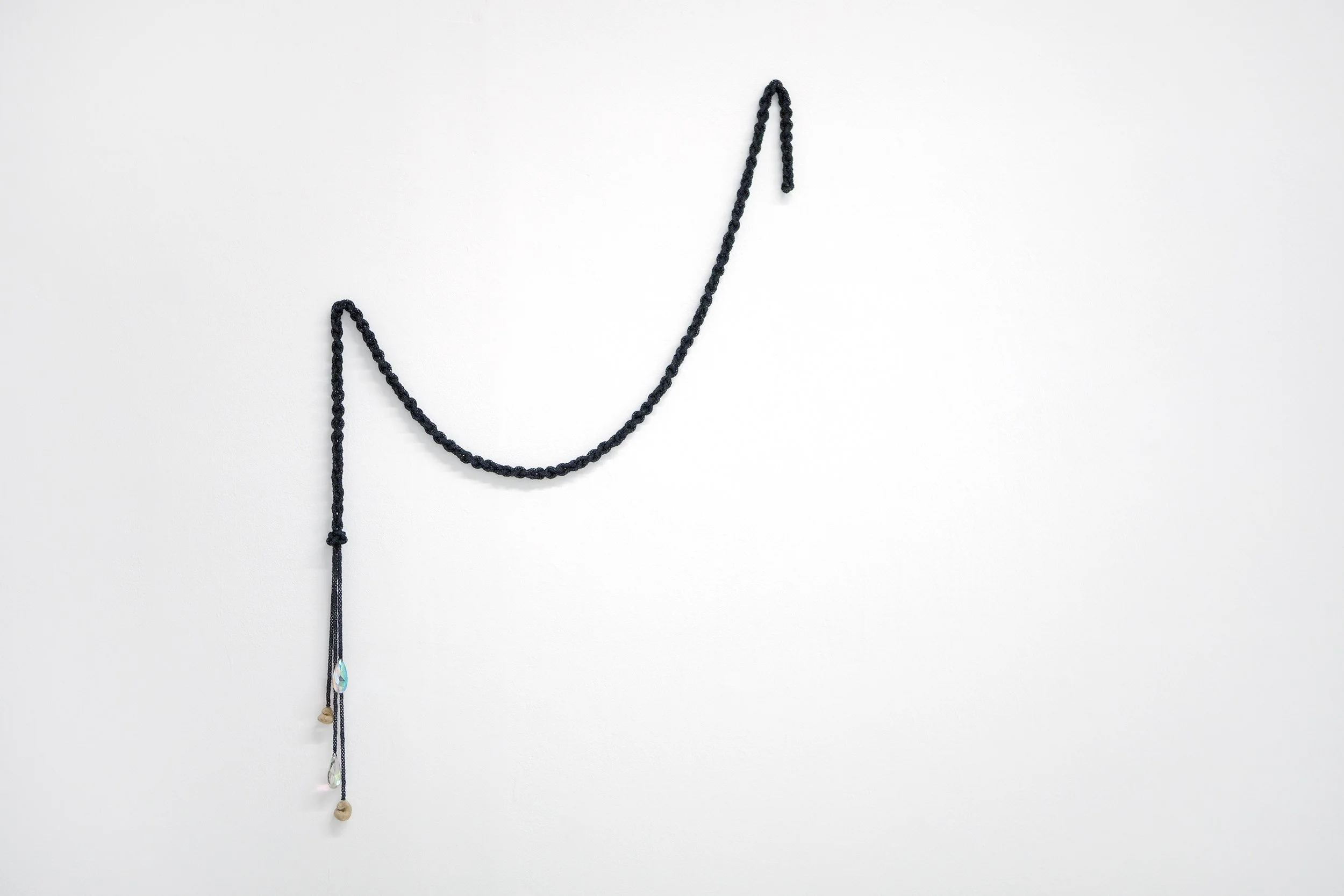    fossils  , 2025 hand-beaded and braided rope with glass beads, vintage a.b. chandelier crystals, and found marine fossils coated in glass road beads 25 × 19 in. 