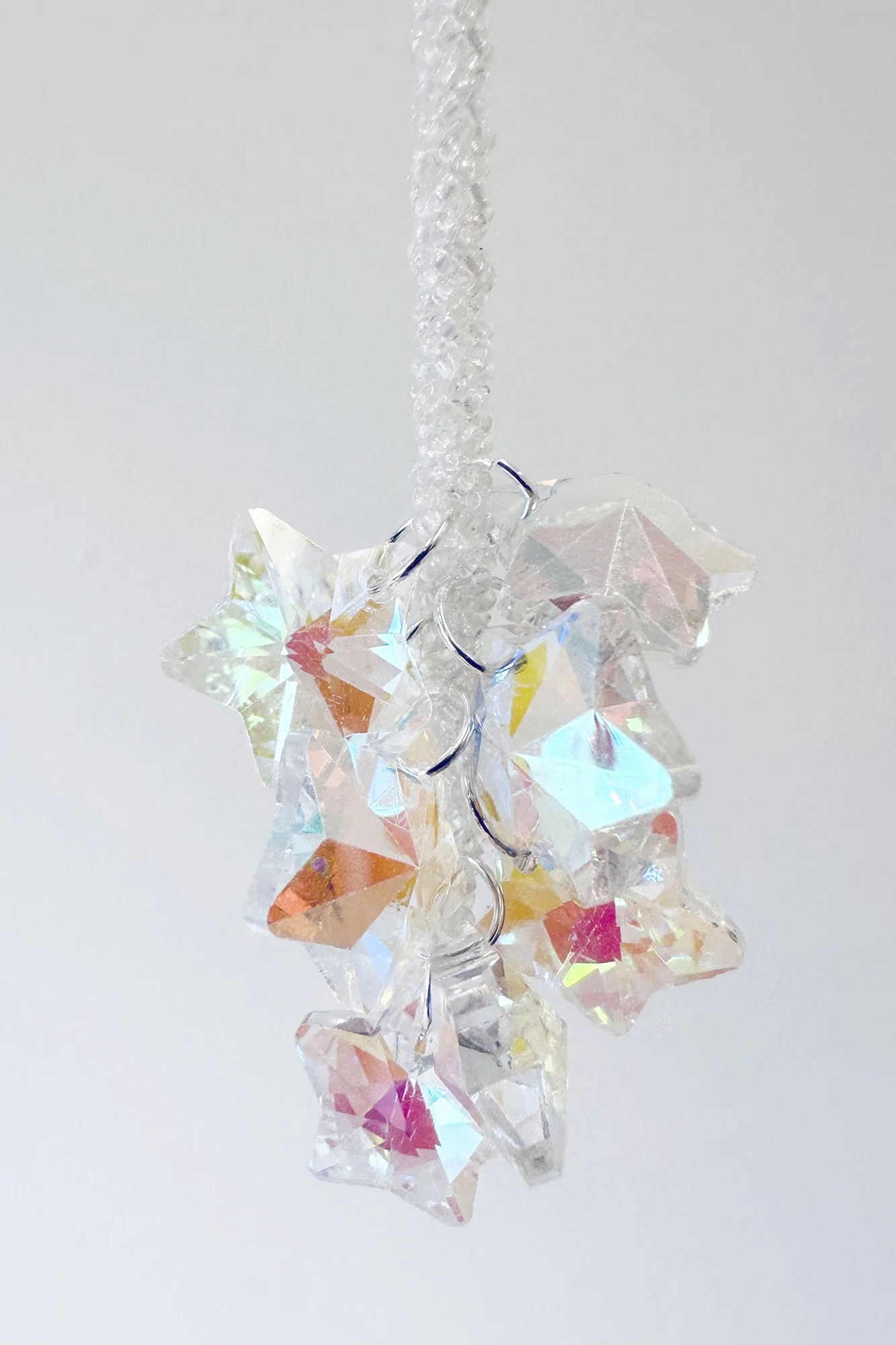    étoiles  , 2025 (detail) hand-beaded rope, a.b. crystal stars 9 ft. x 6 in. x 1.5 in.   Galerie Octave Cowbell , Metz, France 
