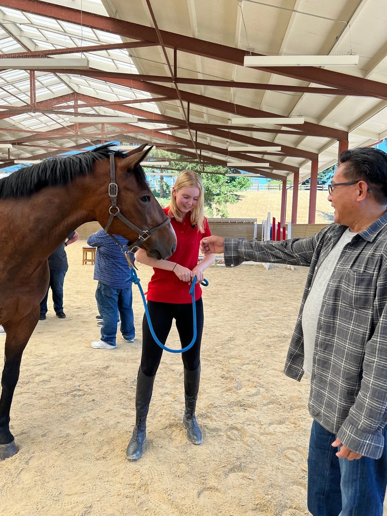 A guest with a horse on the lawn at a Seattle Farm private event