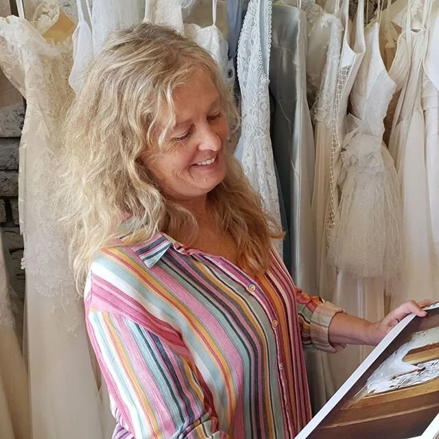 Meet Jo, one half of the brains behind our business. You'll find her behind the sewing machine crafting the gowns to perfection or sharing a laugh with the rest of the team. Her passion for quality and fit goes unmatched and loves getting your garment just right so you feel your best on your special day. It warms her heart looking back on all the beautiful brides she has met over the years.