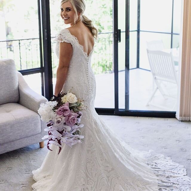 Look at that beautiful smile.✨💖 Precious Carla tied the knot last month in her made to measure @paulaandjo gown. The low v-shaped back creates extra drama as the lace overlay drapes behind her. Congrats to the bride and the entire team involved on t