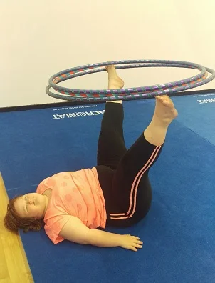 Melissa balancing hoops with toes.jpg