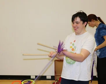 Smiley with flowersticks.jpg