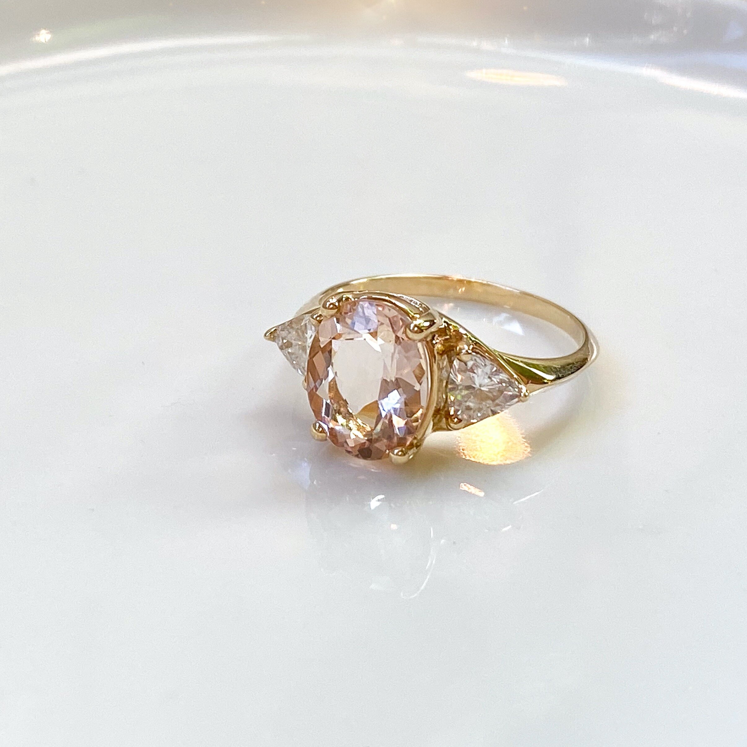 14k yellow gold ring with morganite and side trillion moissanites