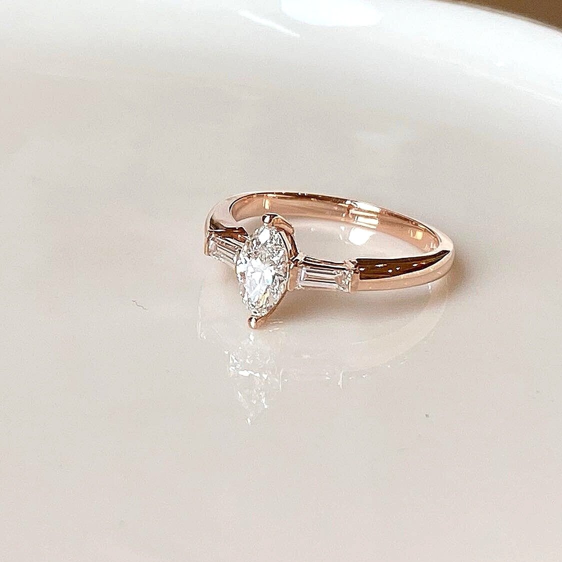 14k rose gold ring with marquis diamond and diamond tapered baguettes