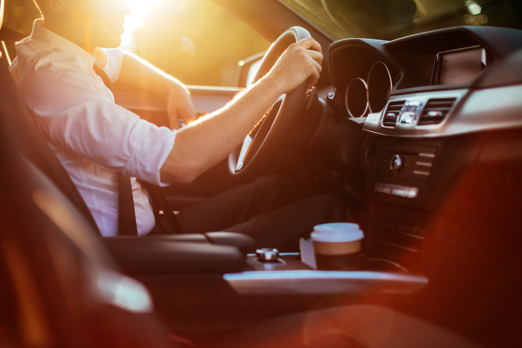 Businessman-driving-a-car-623117826_8574x5715.jpg