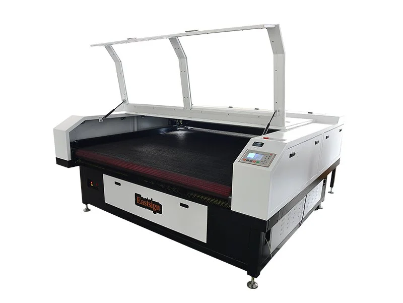 Large industrial laser cutting machine with a white exterior and a glass cover, branded with 'Eastsign', used for cutting materials like fabric or metal.