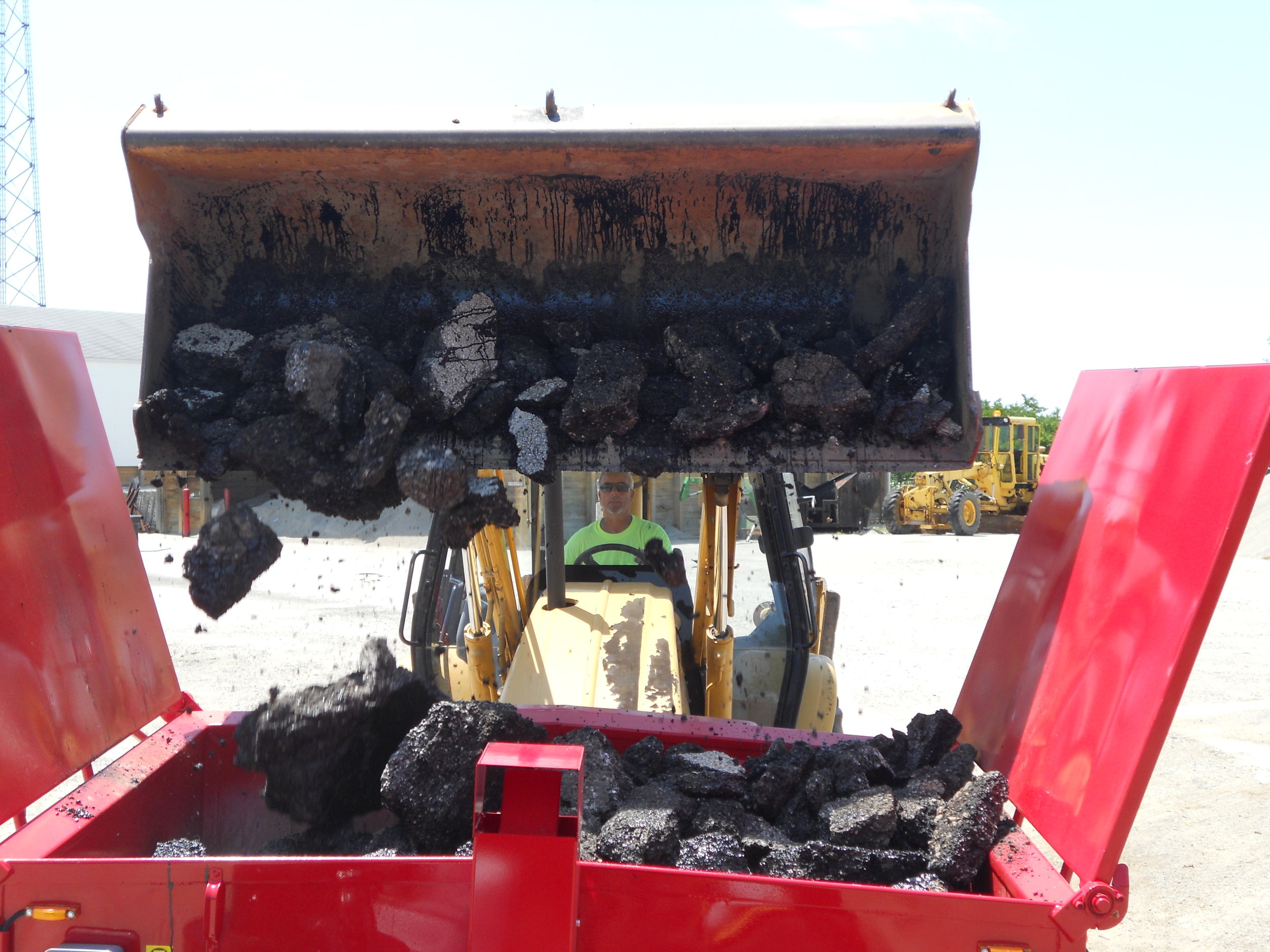 Loading a Falcon with Asphalt RAP and Millings to be Recycled