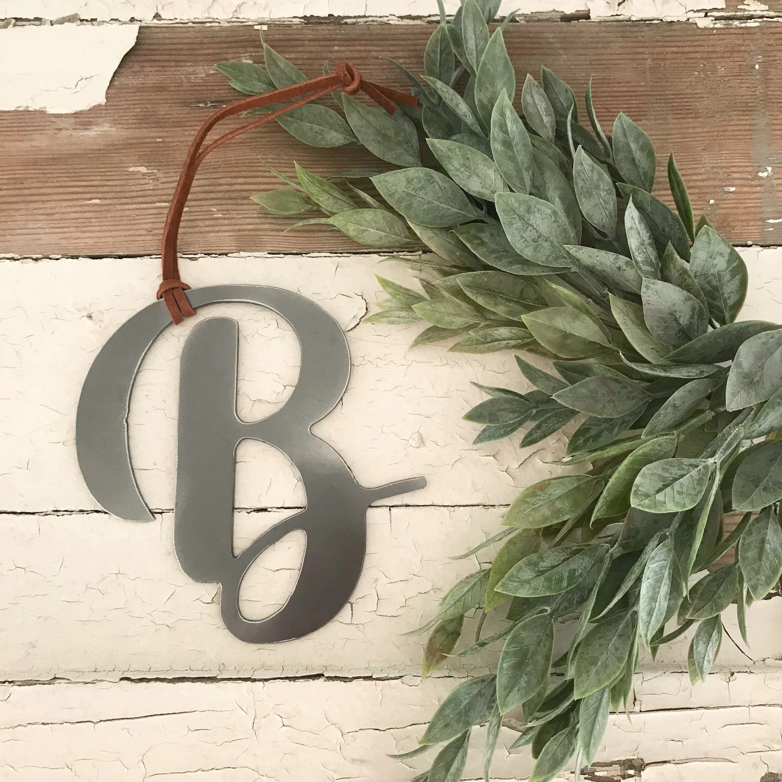New, simplified monogram ornaments . Use one initial for each stocking tag, or simply get your family monogram for your tree.
