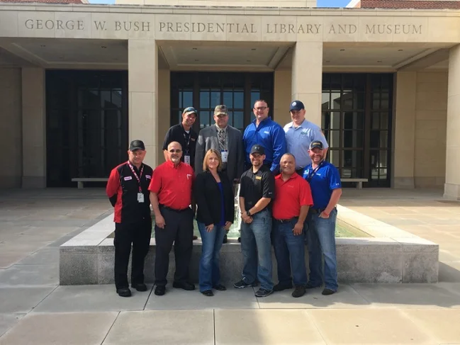  Top 10 Finalists stand outside the George W. Bush Presidential Library and Museum.