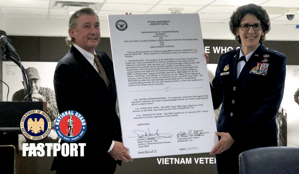 FASTPORT CEO Bill McLennan (left) and Brigadier General Jessica Meyeraan (right) display MOU between the organizations with 29 employers gathered at the Pentagon to sign ESGR Statements of Support.
