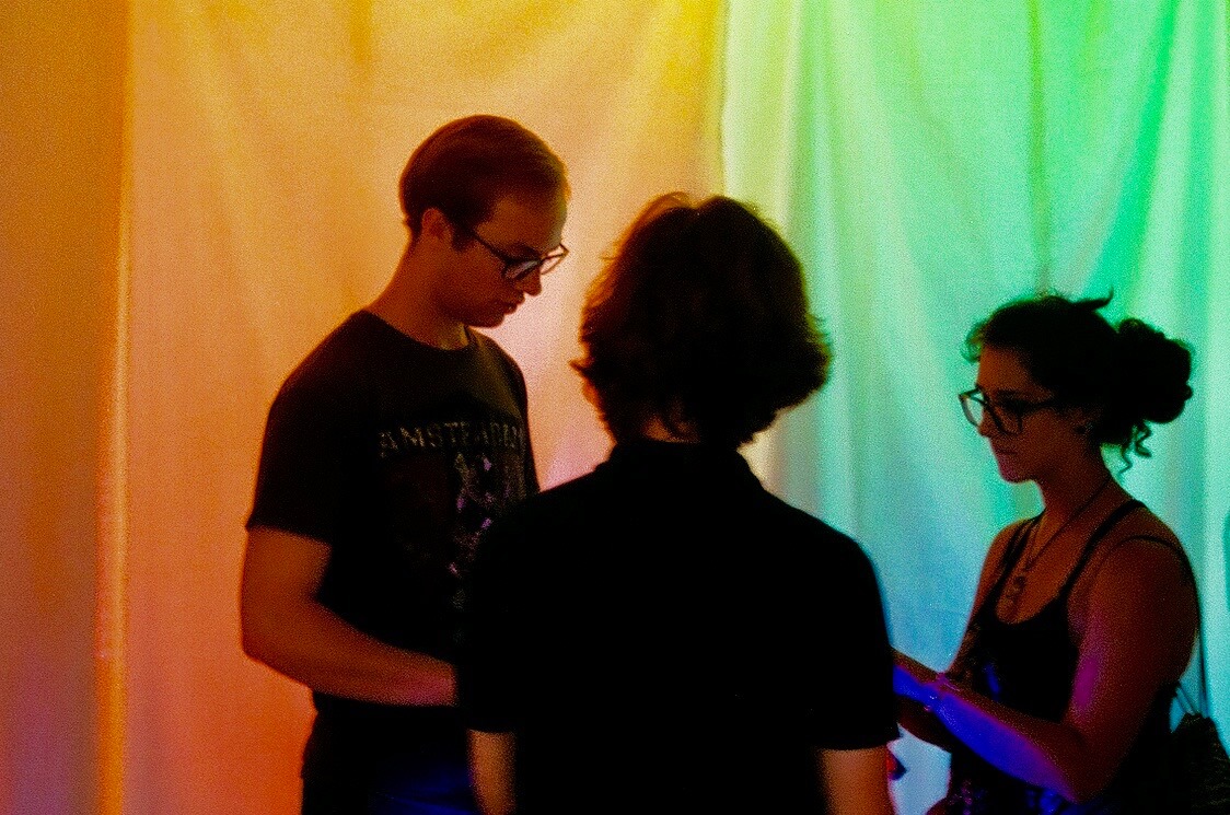 Festival attendees jamming with mora (hidden)