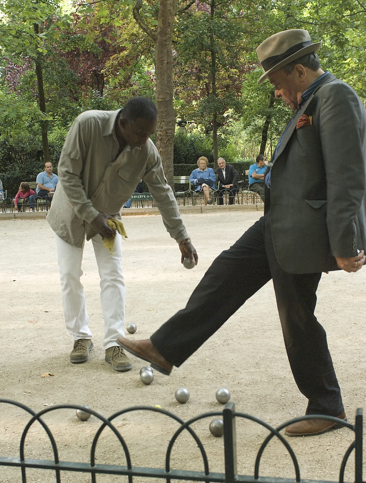 Men play petanque in Luxembourg Garden in Paris. Image by New Orleans based travel photographer, Marc Pagani - marcpagani.com.