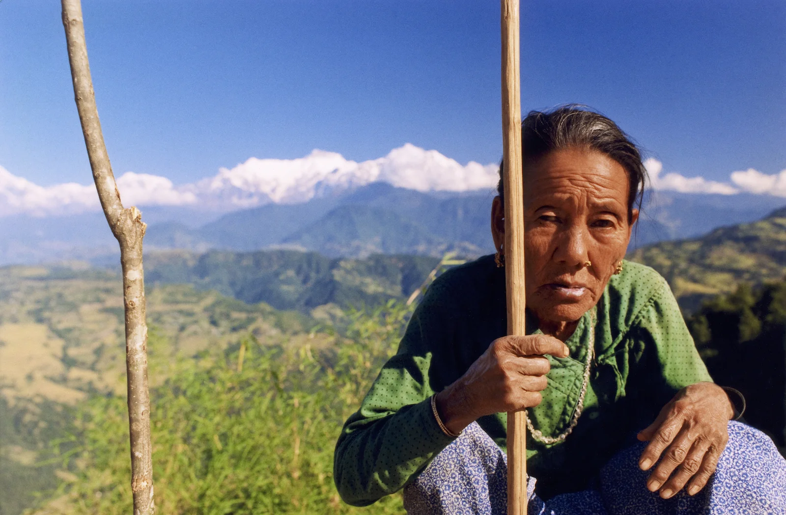 Gurung matriarch on the Royal Trek in Nepal. Image by New Orleans based travel photographer, Marc Pagani